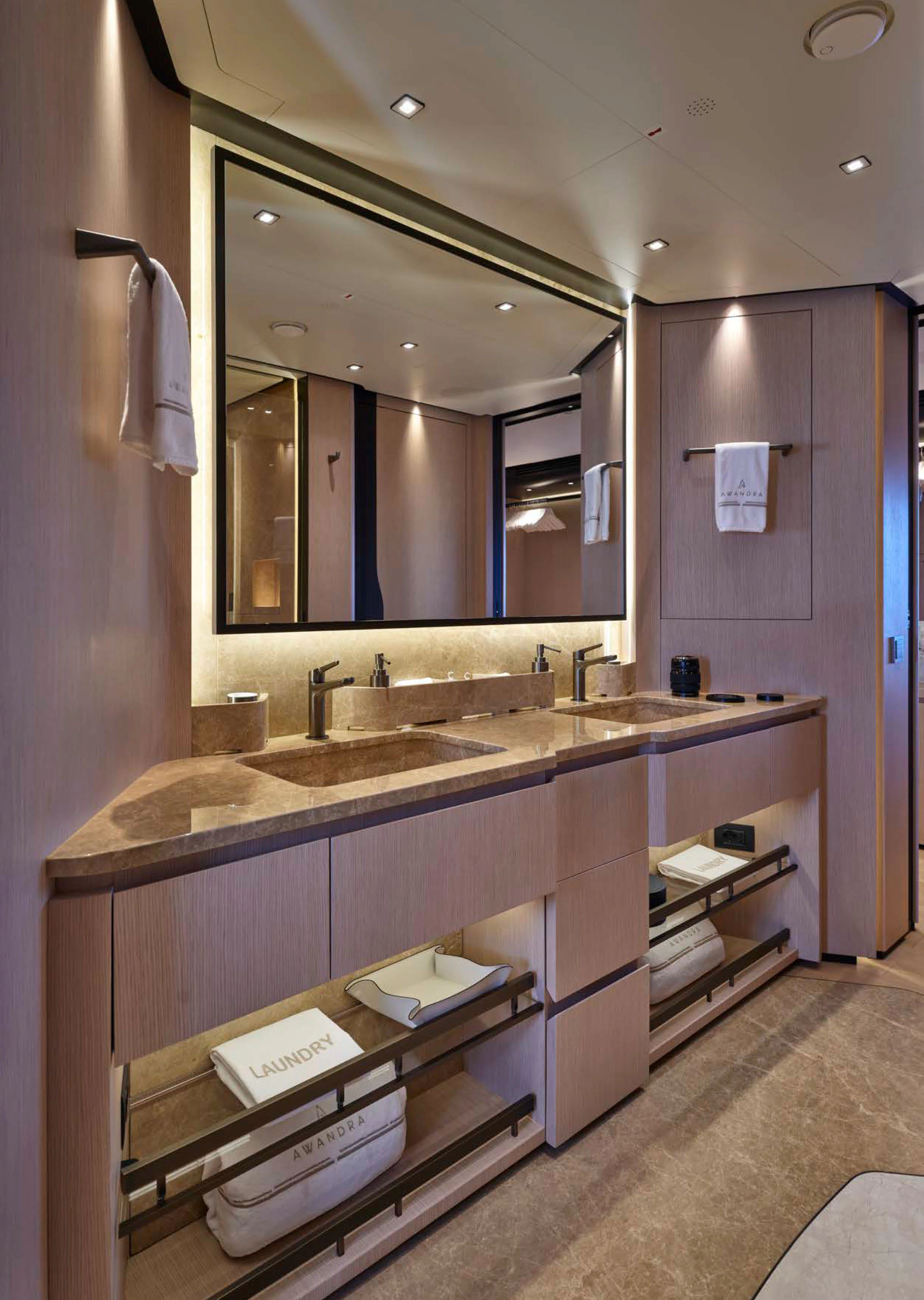a bathroom with a large mirror aboard AWANDRA Yacht for Charter