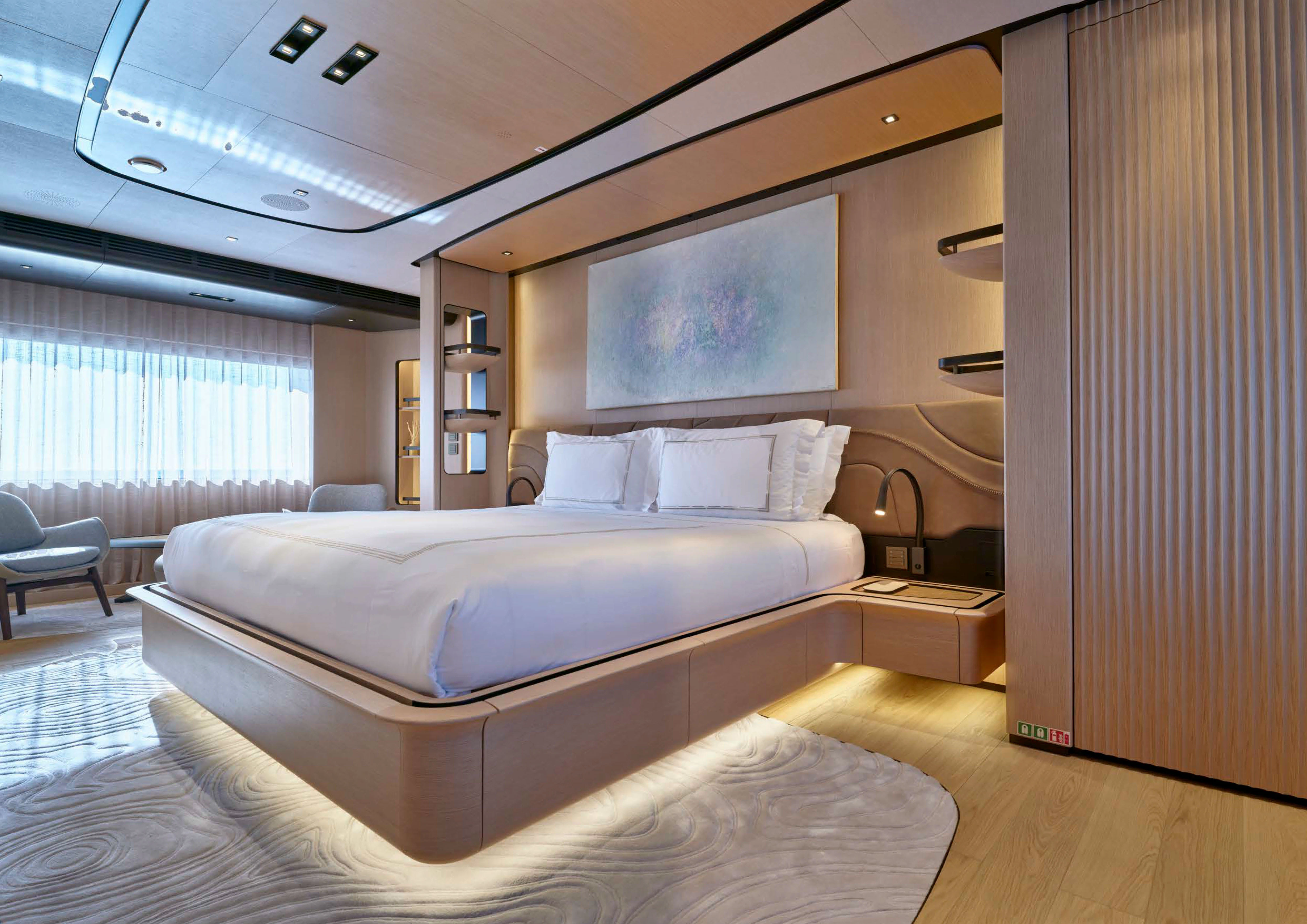 a bedroom with a large bed aboard AWANDRA Yacht for Charter