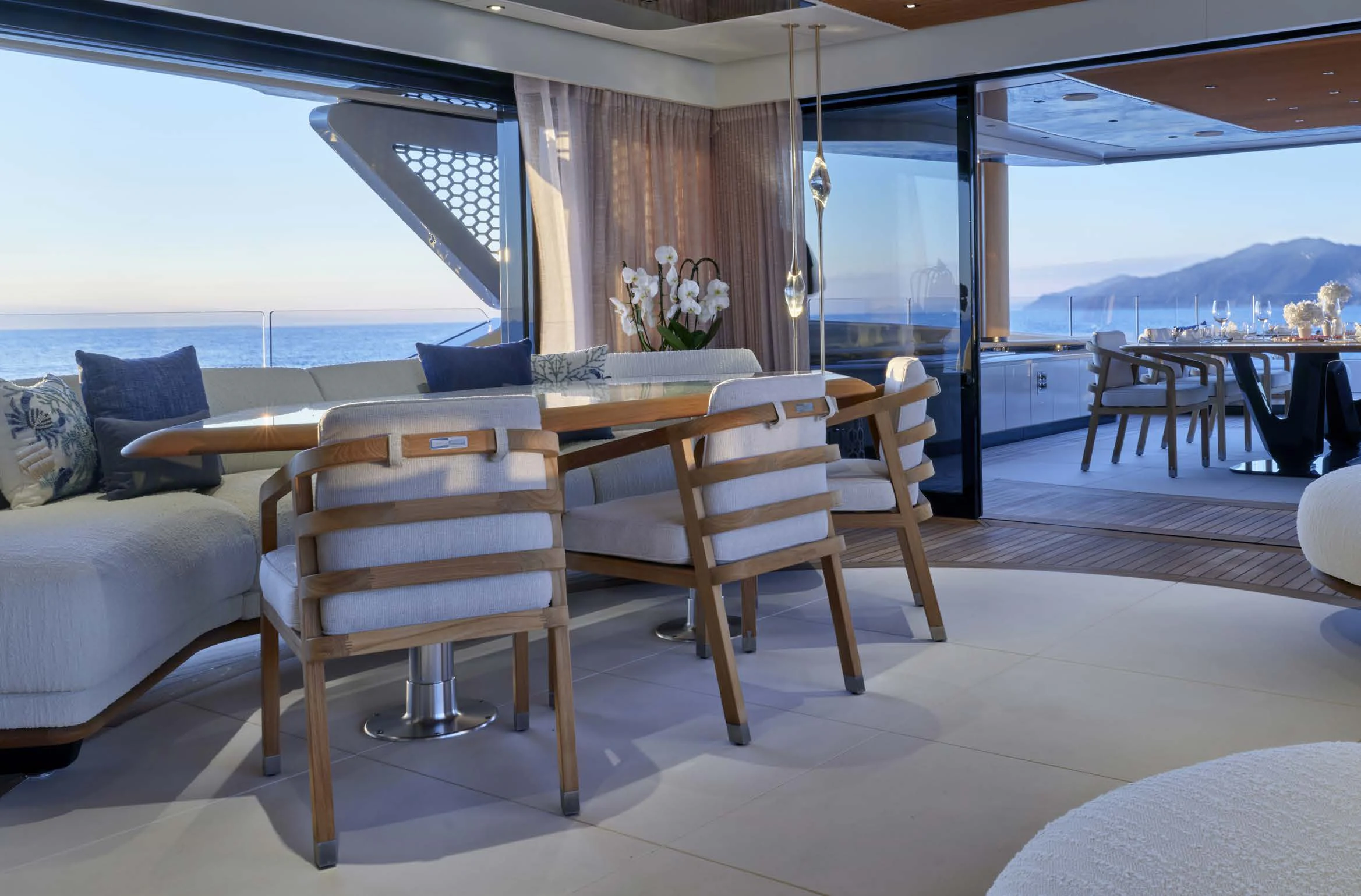 a room with a table and chairs aboard AWANDRA Yacht for Charter