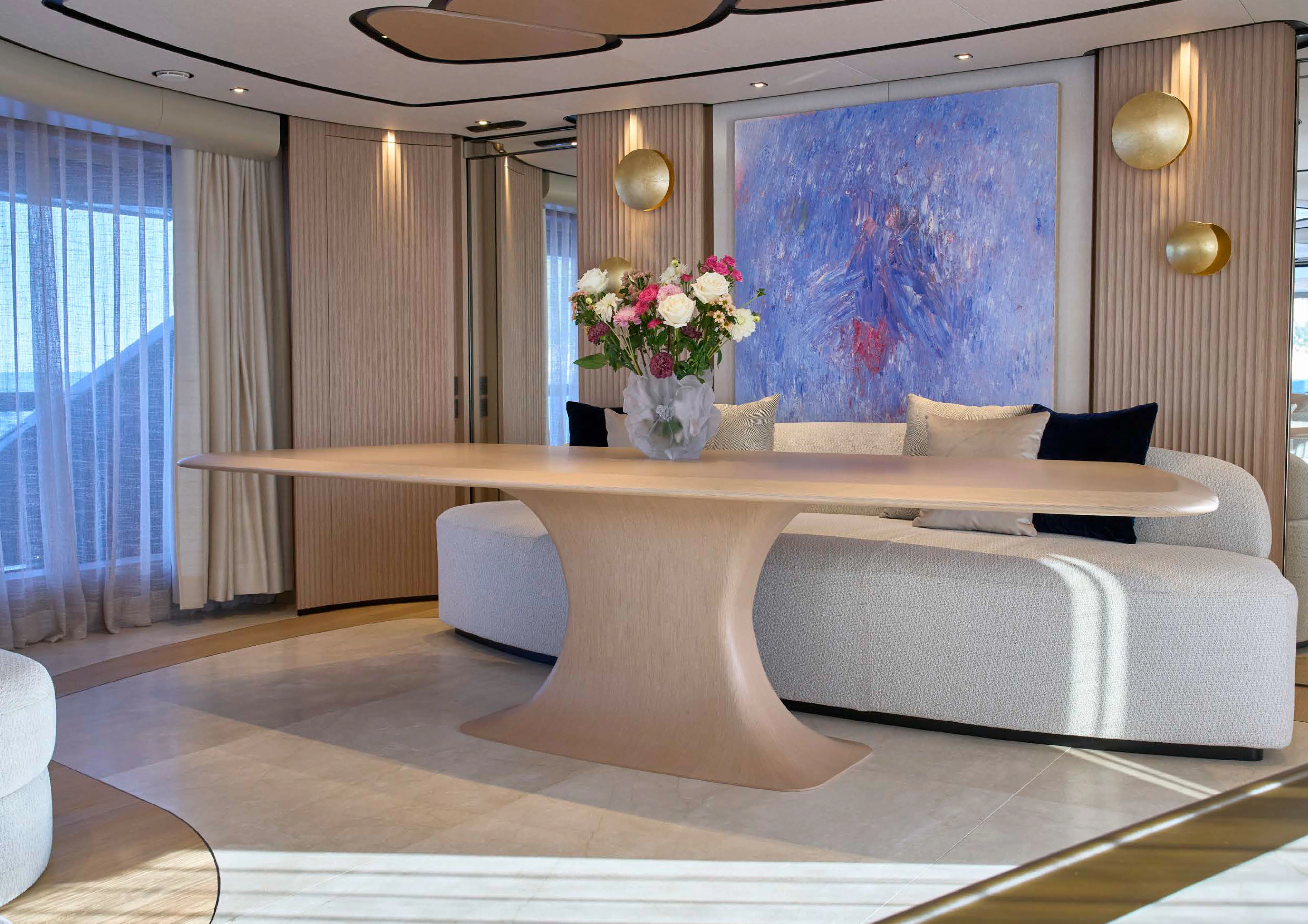 a room with a bed and a table aboard AWANDRA Yacht for Charter