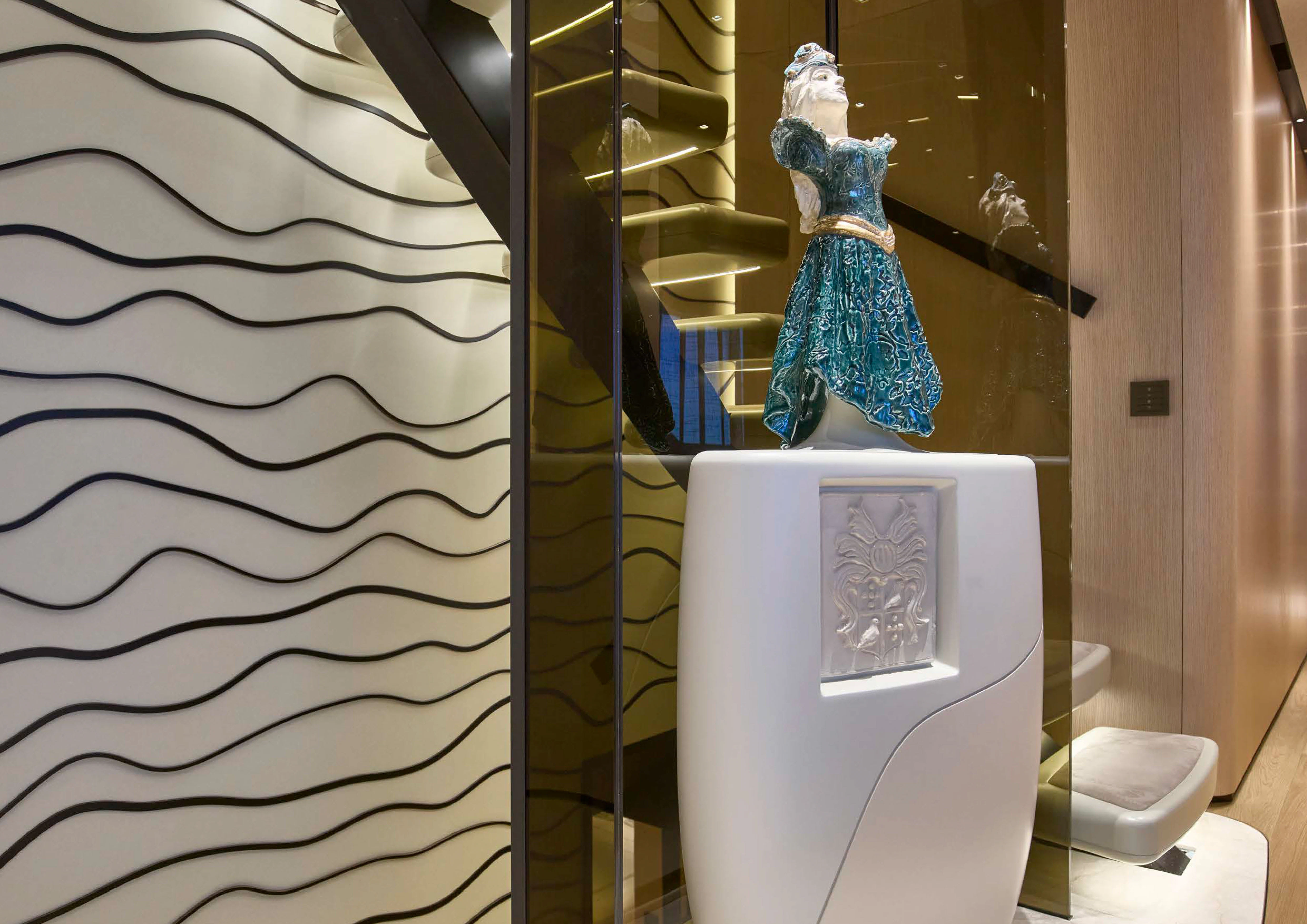 a statue of a person in a dress in a bathroom aboard AWANDRA Yacht for Charter
