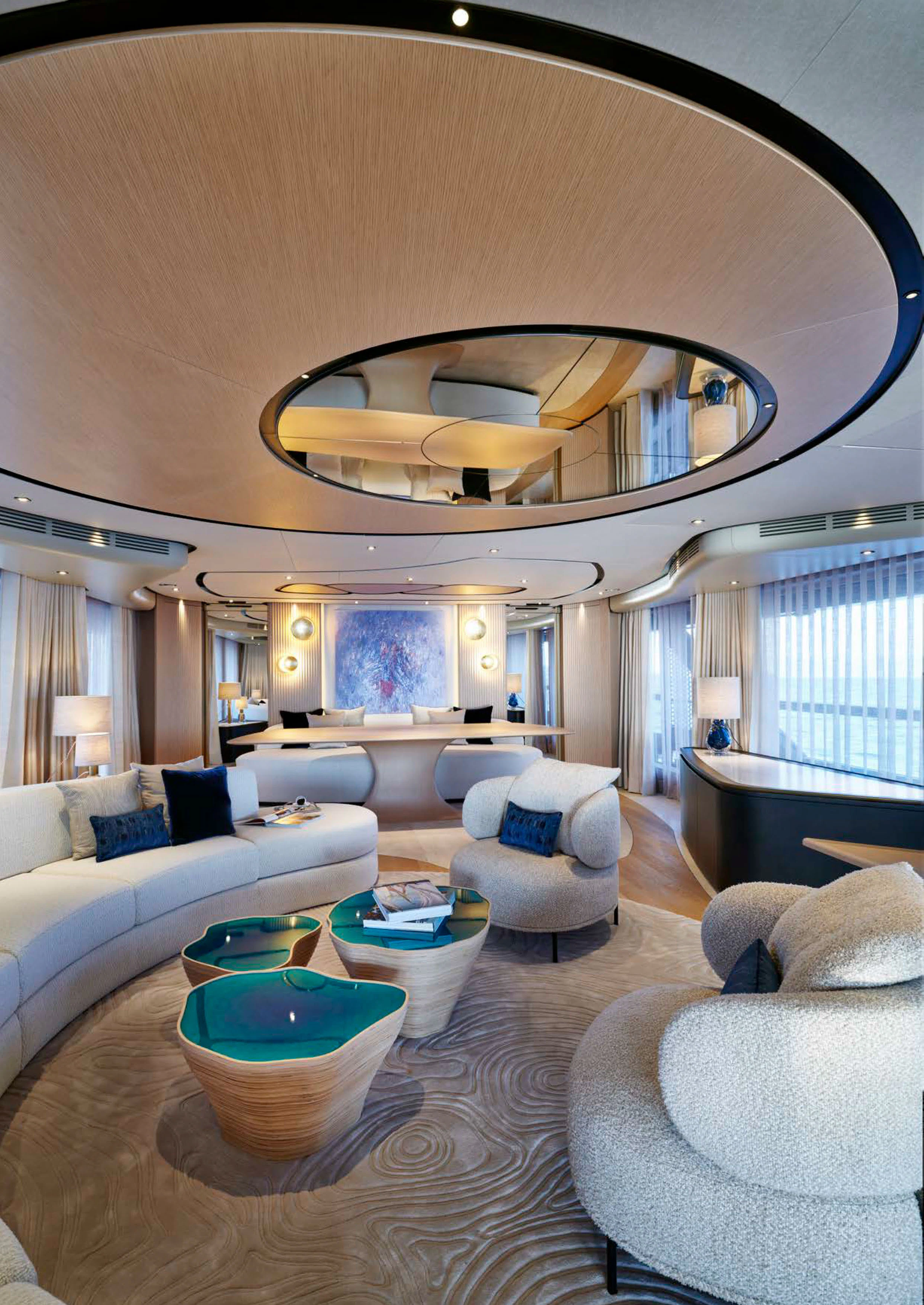 a large living room with a chandelier aboard AWANDRA Yacht for Charter