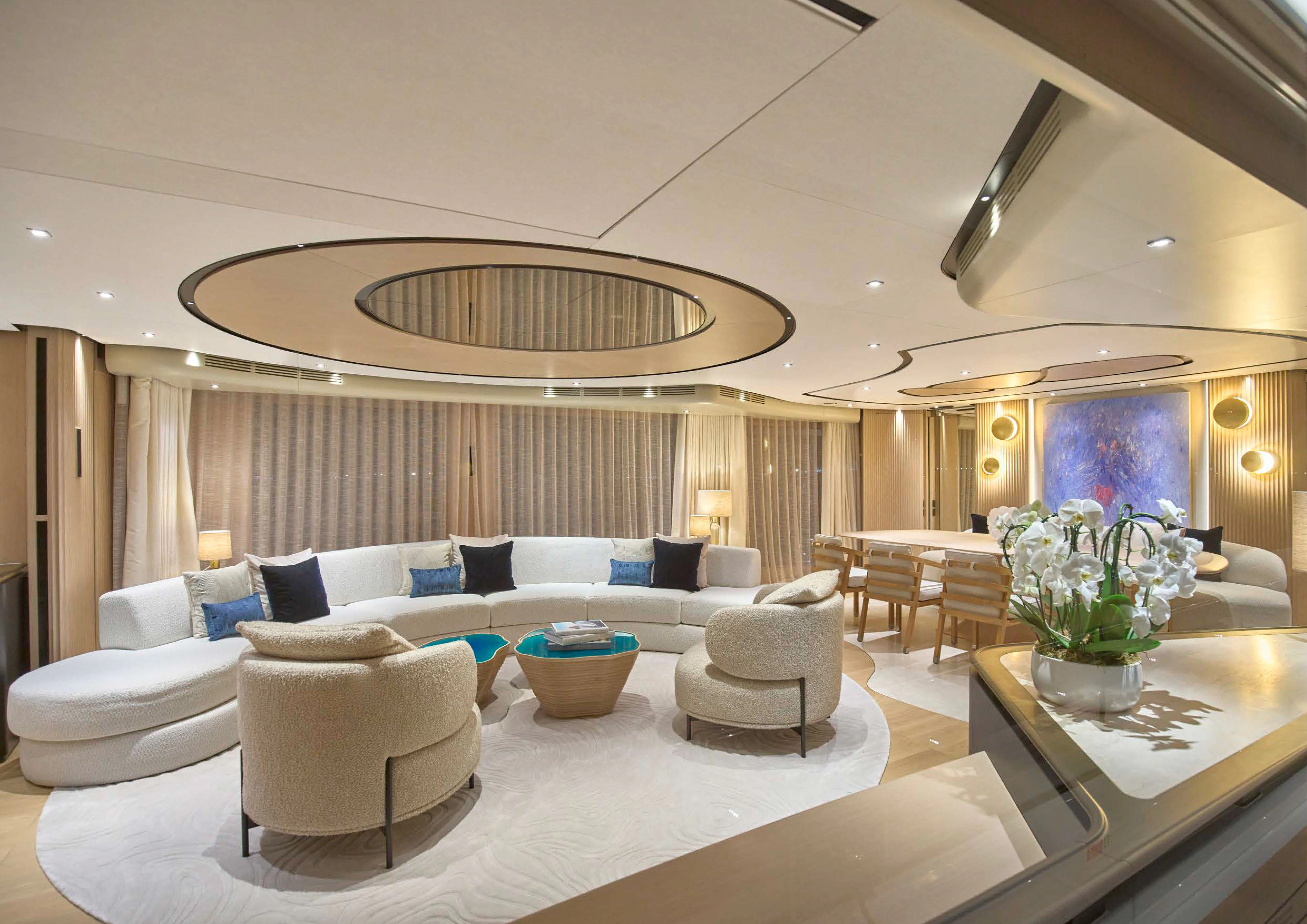 a large living room with a large chandelier aboard AWANDRA Yacht for Charter