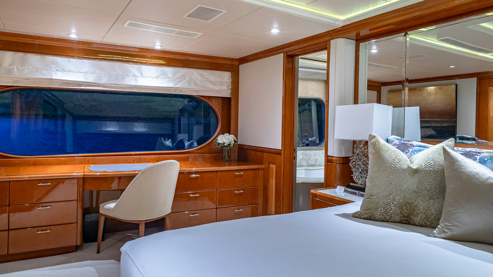 a room with a bed and a tv aboard MILESTONE Yacht for Charter