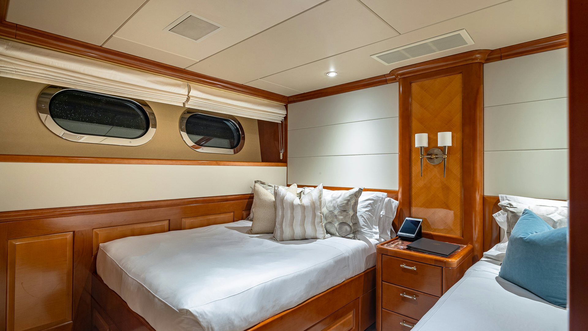a room with two beds aboard MILESTONE Yacht for Charter
