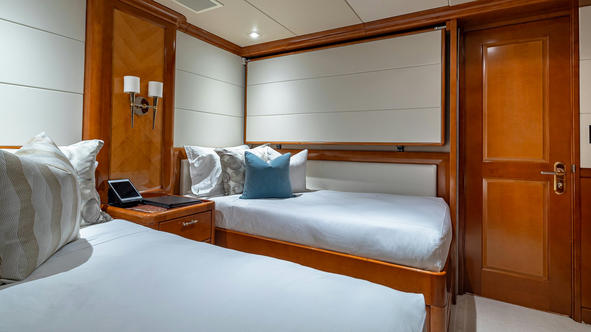 a couple of beds in a hotel room aboard MILESTONE Yacht for Charter