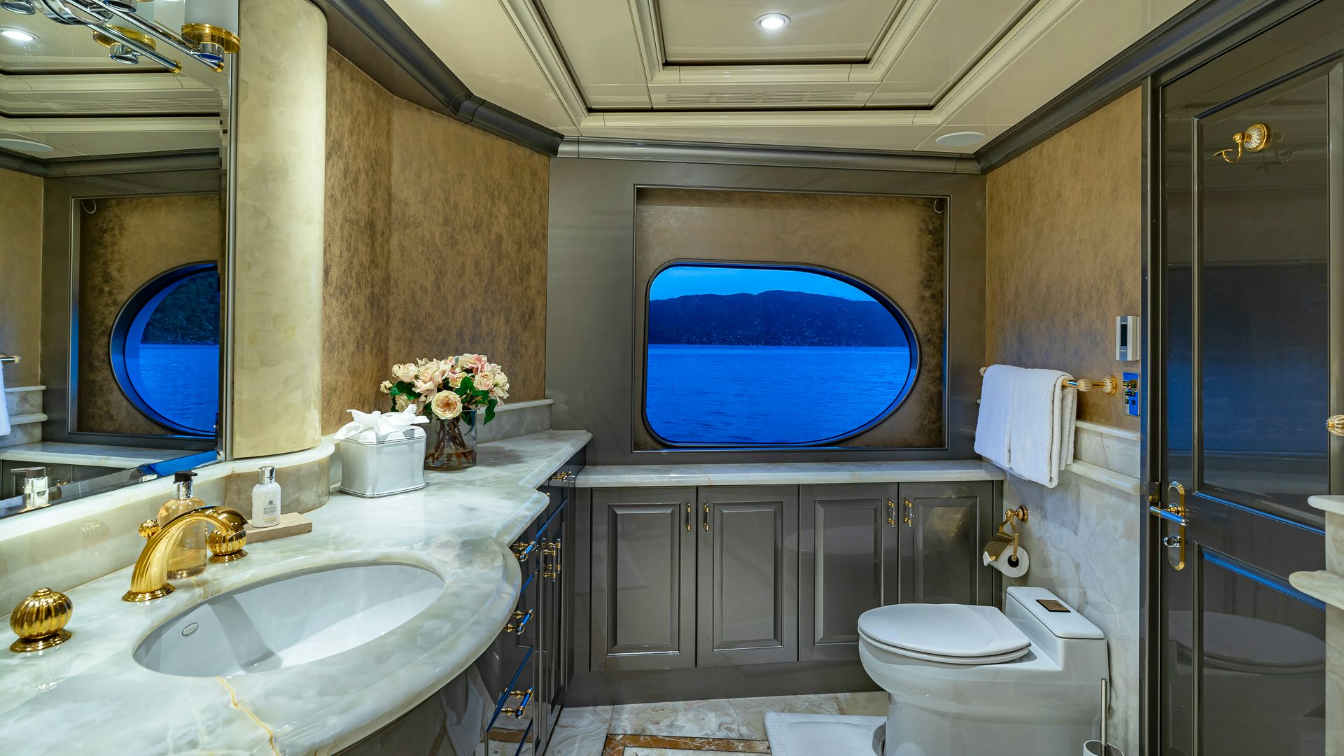 a bathroom with a sink toilet and a bathtub aboard MILESTONE Yacht for Charter