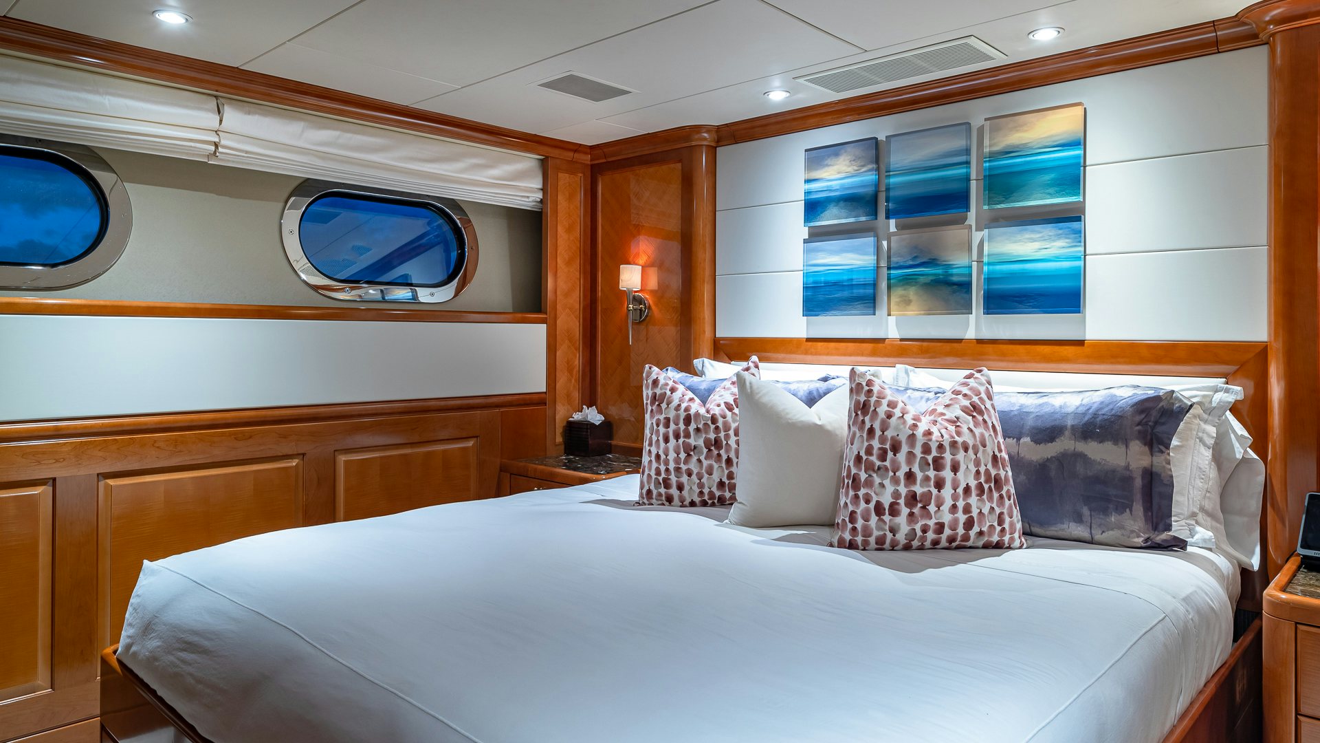a bed with pillows aboard MILESTONE Yacht for Charter