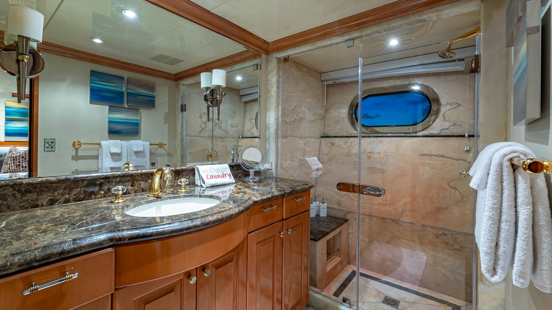 a bathroom with a large mirror aboard MILESTONE Yacht for Charter