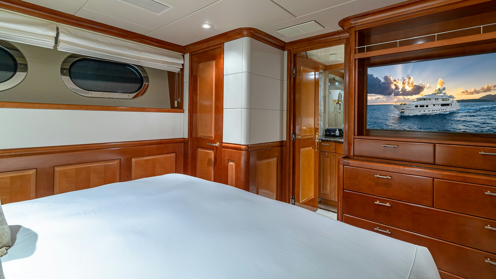 a room with a bed and a window aboard MILESTONE Yacht for Charter