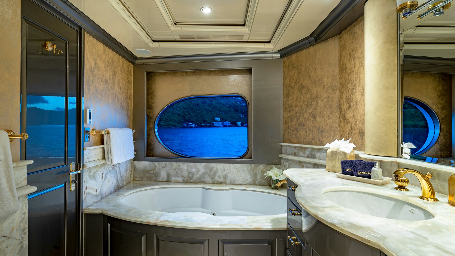 a bathroom with a large jacuzzi tub aboard MILESTONE Yacht for Charter
