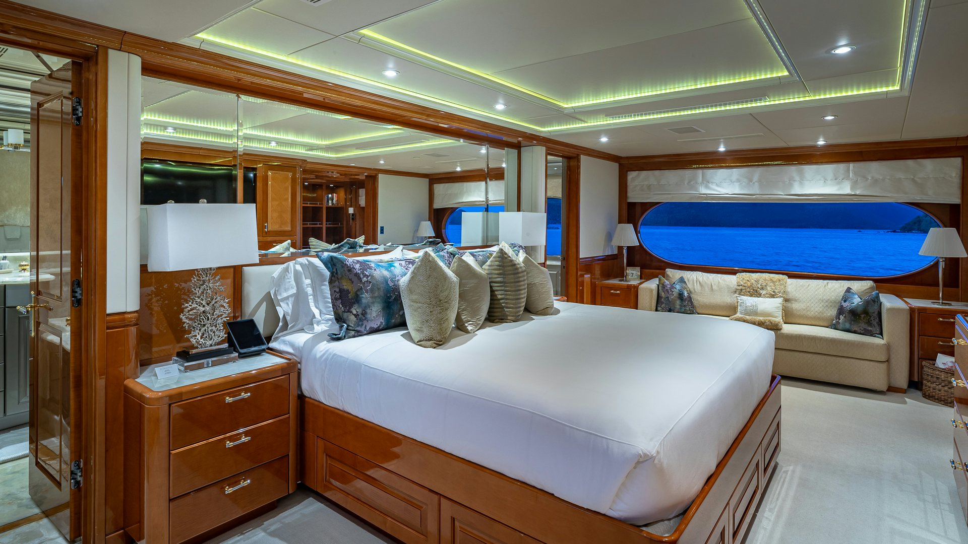 a bedroom with a bed and a desk aboard MILESTONE Yacht for Charter