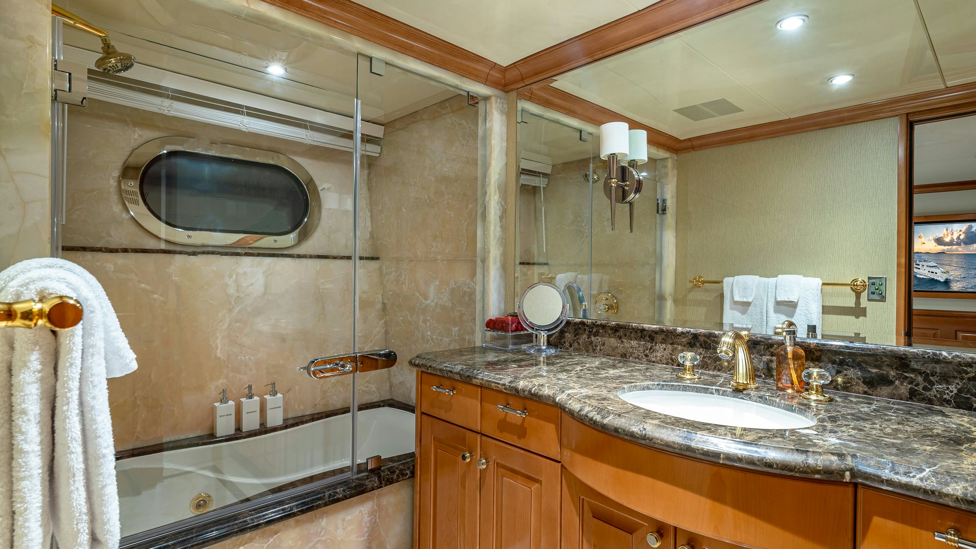 a bathroom with a large mirror aboard MILESTONE Yacht for Charter