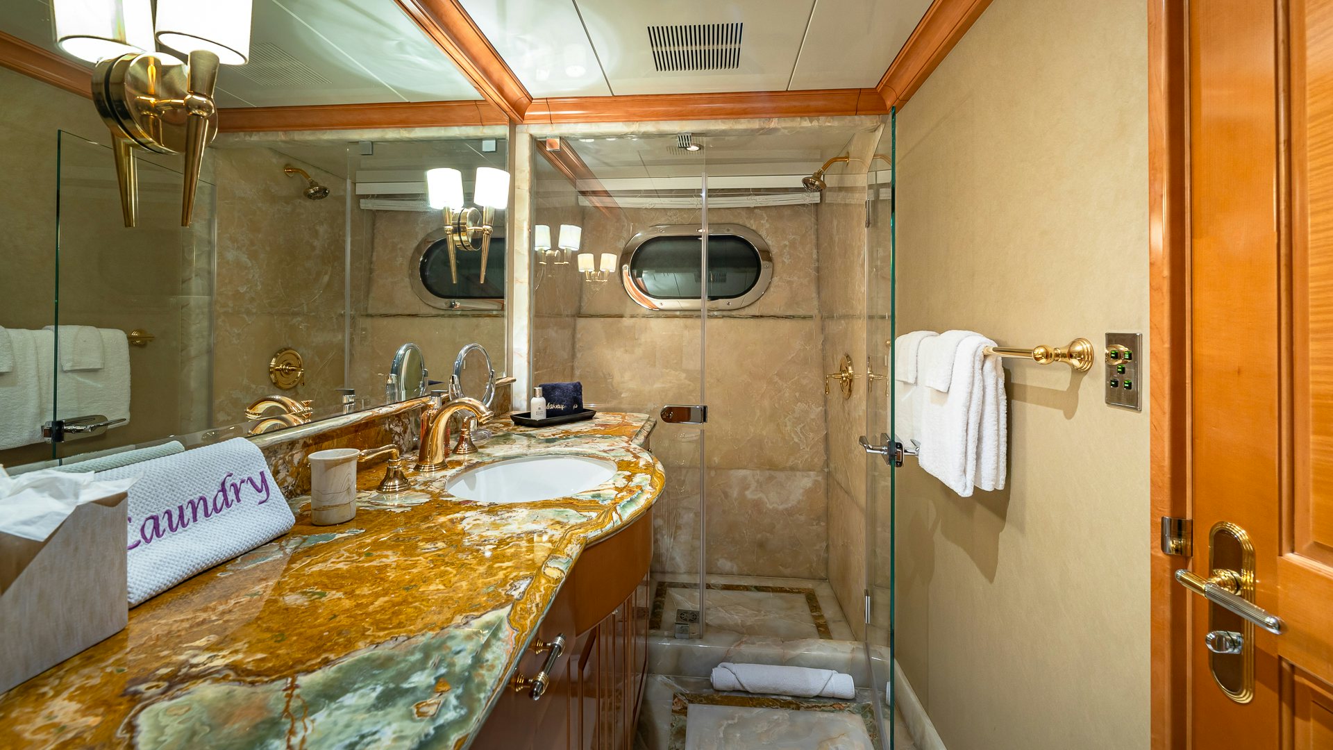 a bathroom with a sink and a bathtub aboard MILESTONE Yacht for Charter