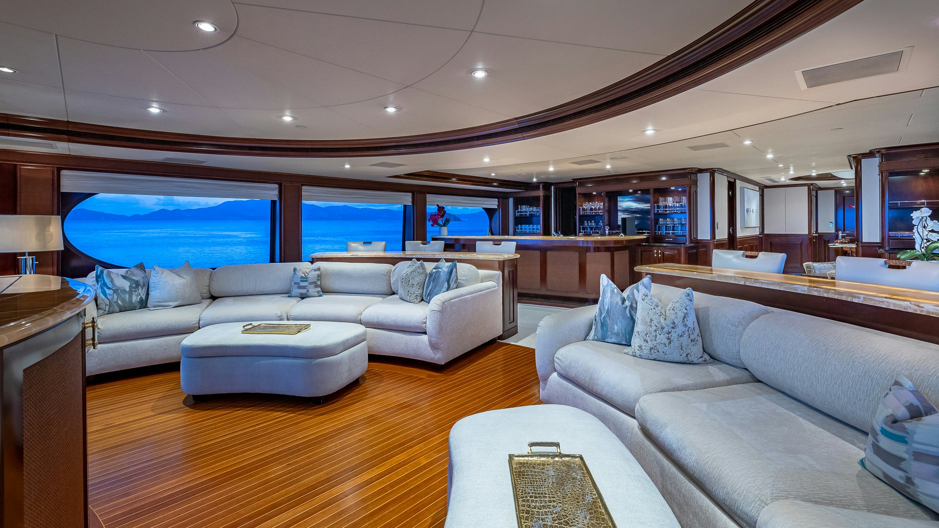a living room with a large window aboard MILESTONE Yacht for Charter