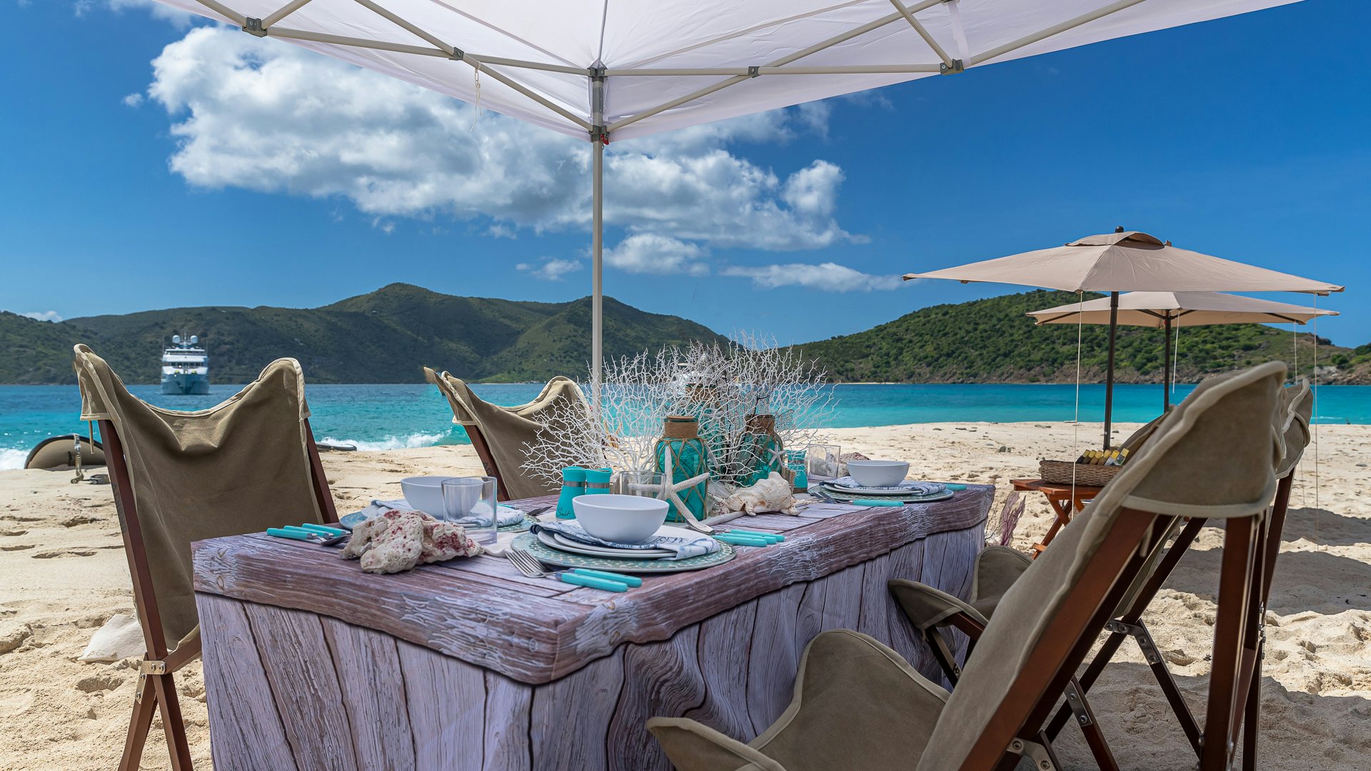 a table with chairs and umbrellas on it aboard MILESTONE Yacht for Charter