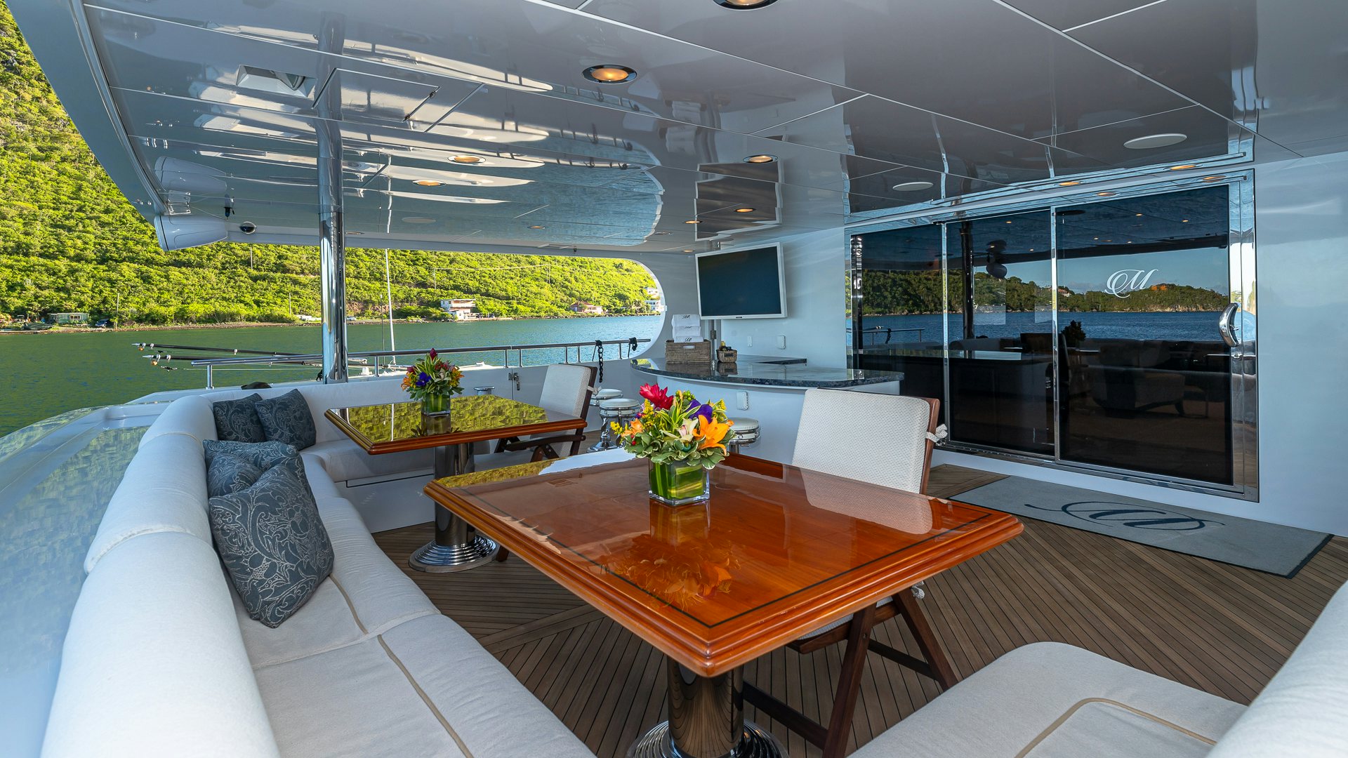 a room with a table and chairs aboard MILESTONE Yacht for Charter