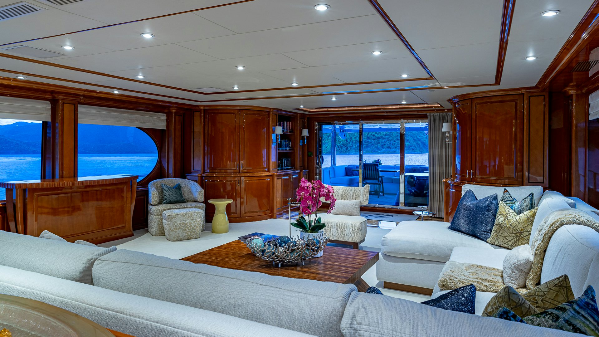 a living room with a large window aboard MILESTONE Yacht for Charter