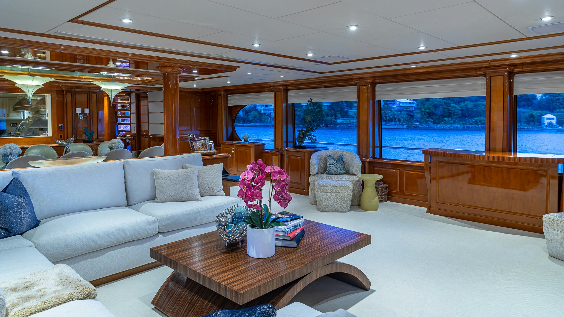 a living room with a large window aboard MILESTONE Yacht for Charter