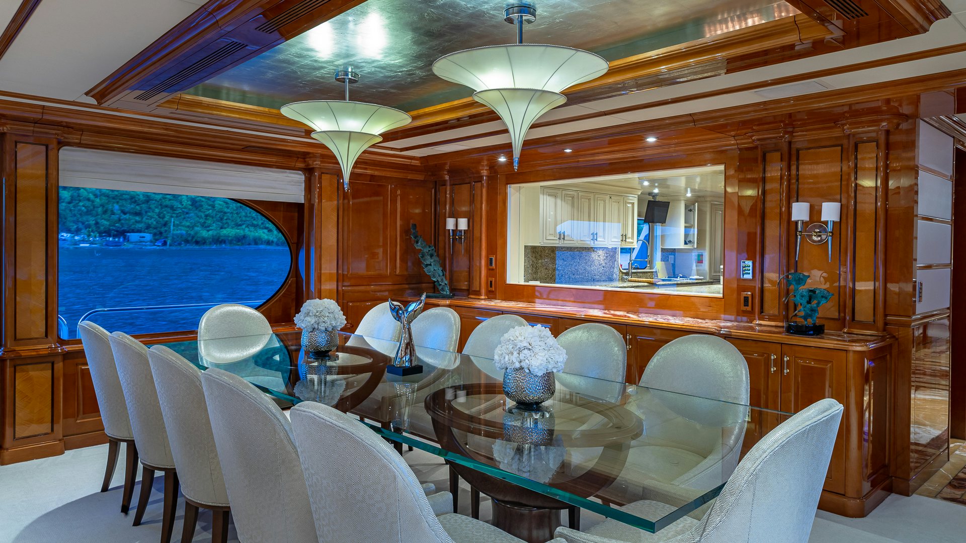a room with a table chairs and a window aboard MILESTONE Yacht for Charter