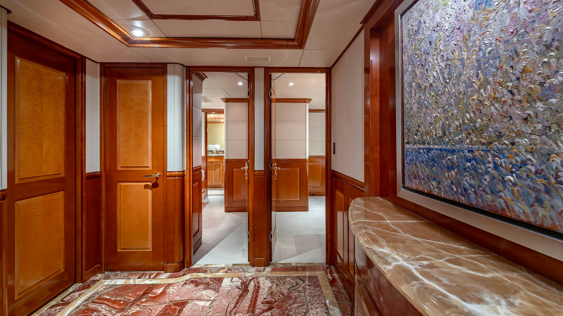 a room with a painting on the wall aboard MILESTONE Yacht for Charter