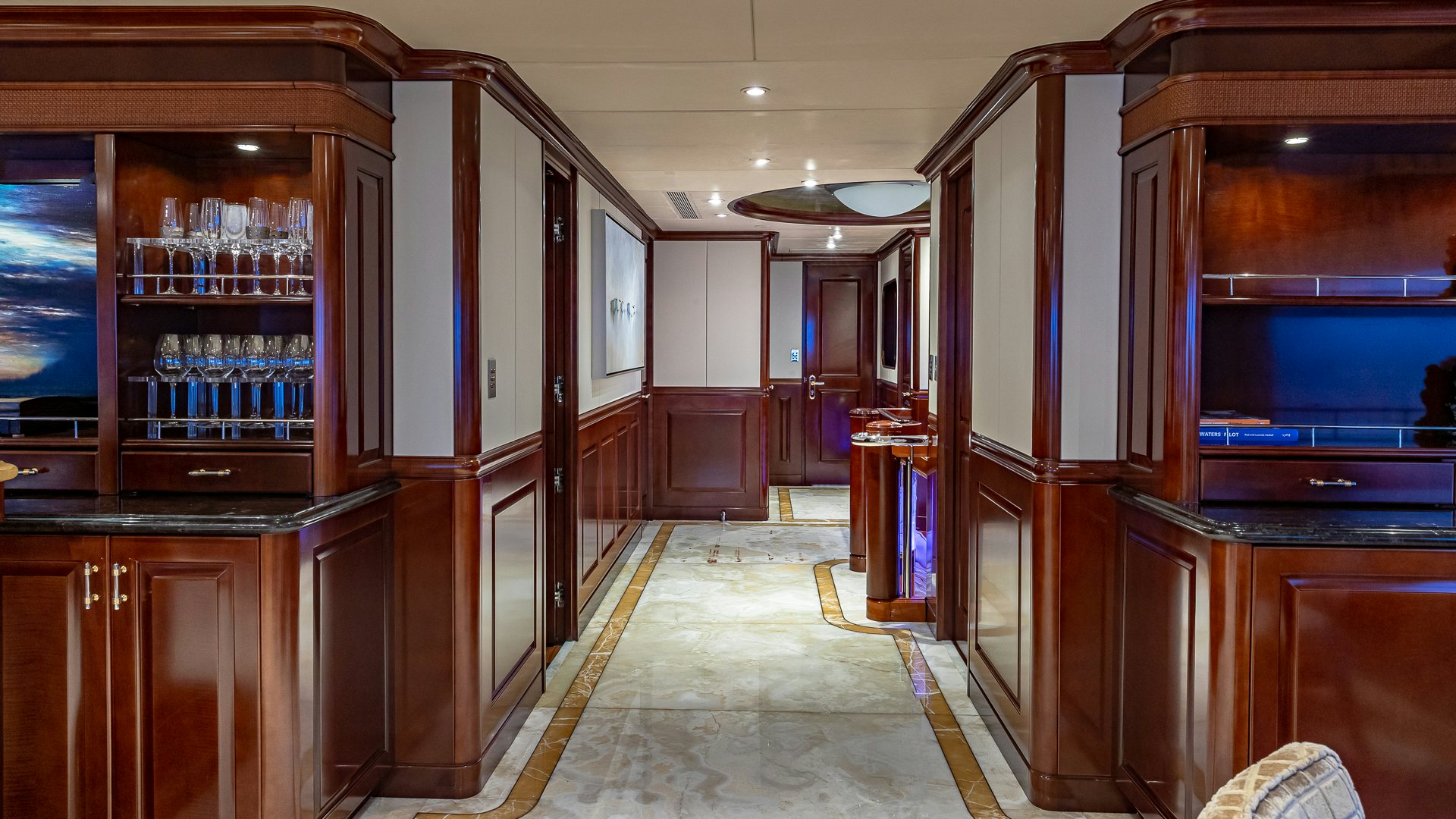 a room with a bar and cabinets aboard MILESTONE Yacht for Charter