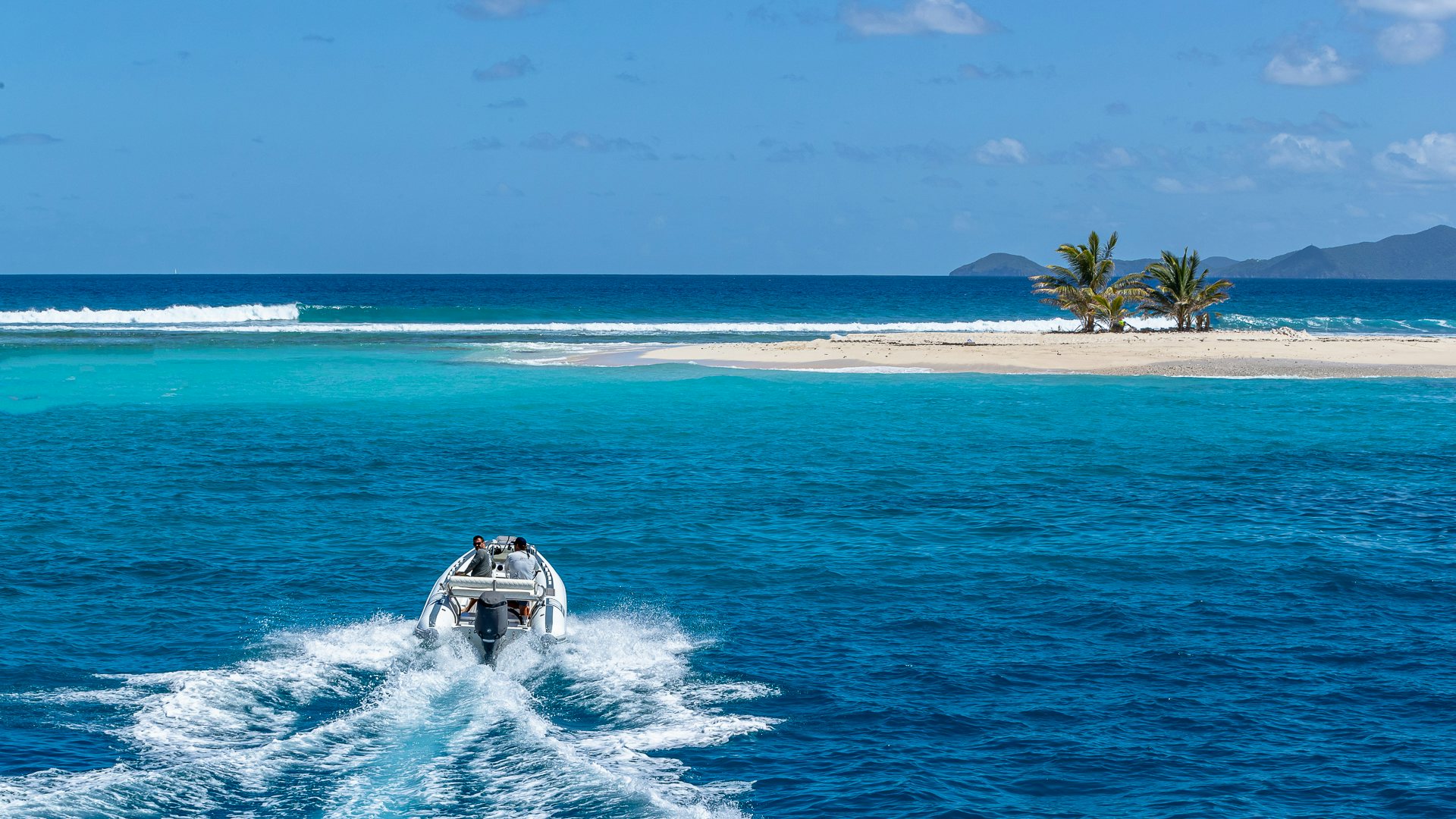 a person riding a jet ski on the ocean aboard MILESTONE Yacht for Charter
