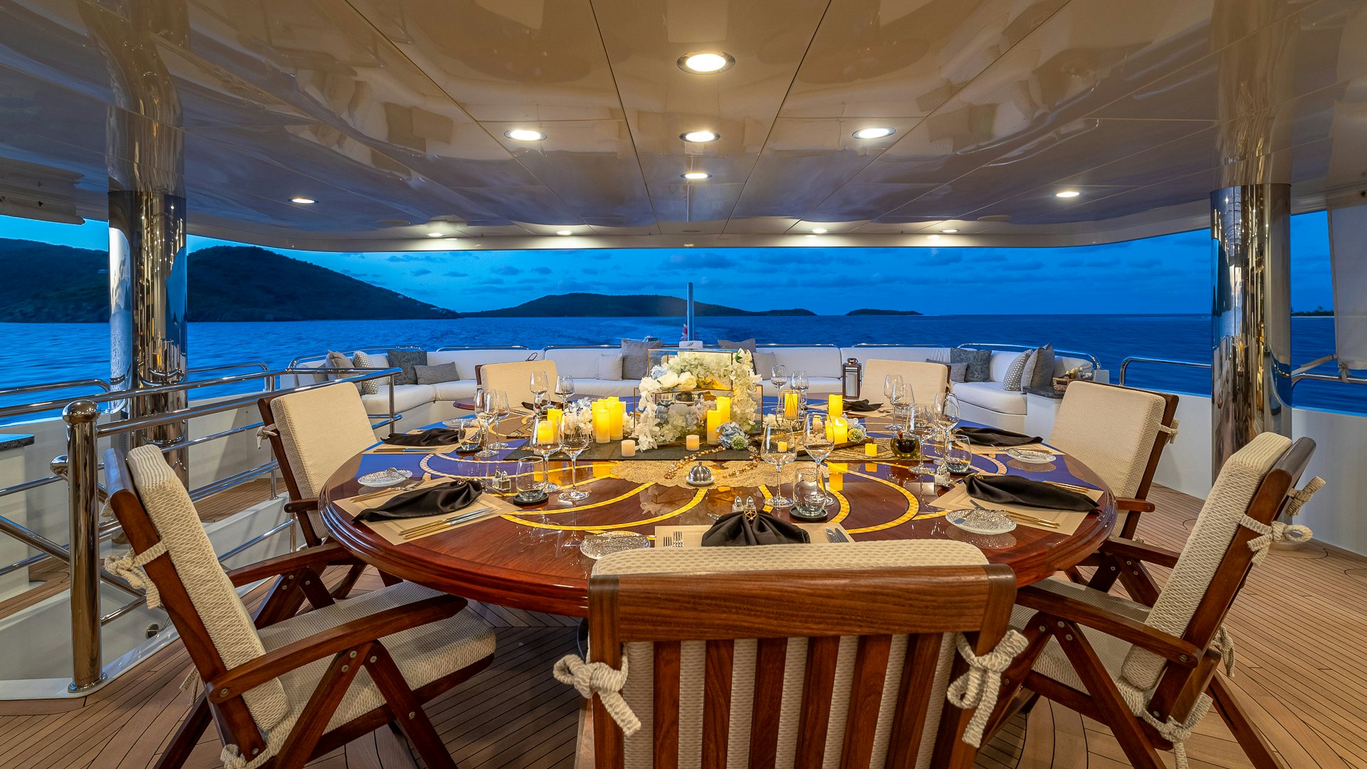 a table set for a dinner party aboard MILESTONE Yacht for Charter