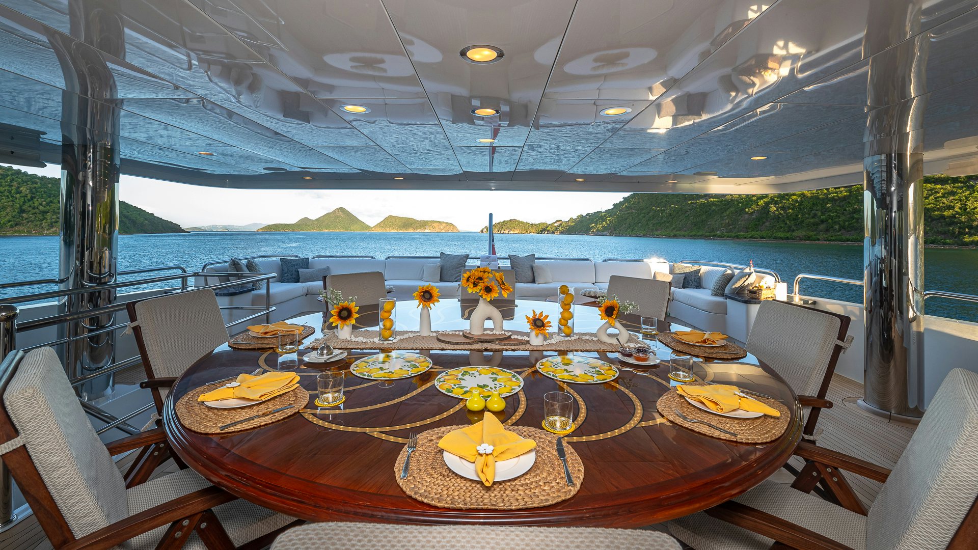 a table with plates and glasses on it aboard MILESTONE Yacht for Charter