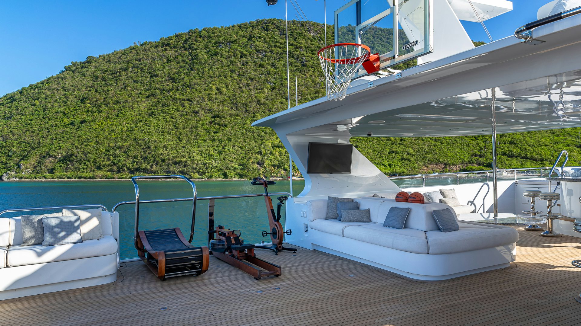a deck with a pool and a slide aboard MILESTONE Yacht for Charter