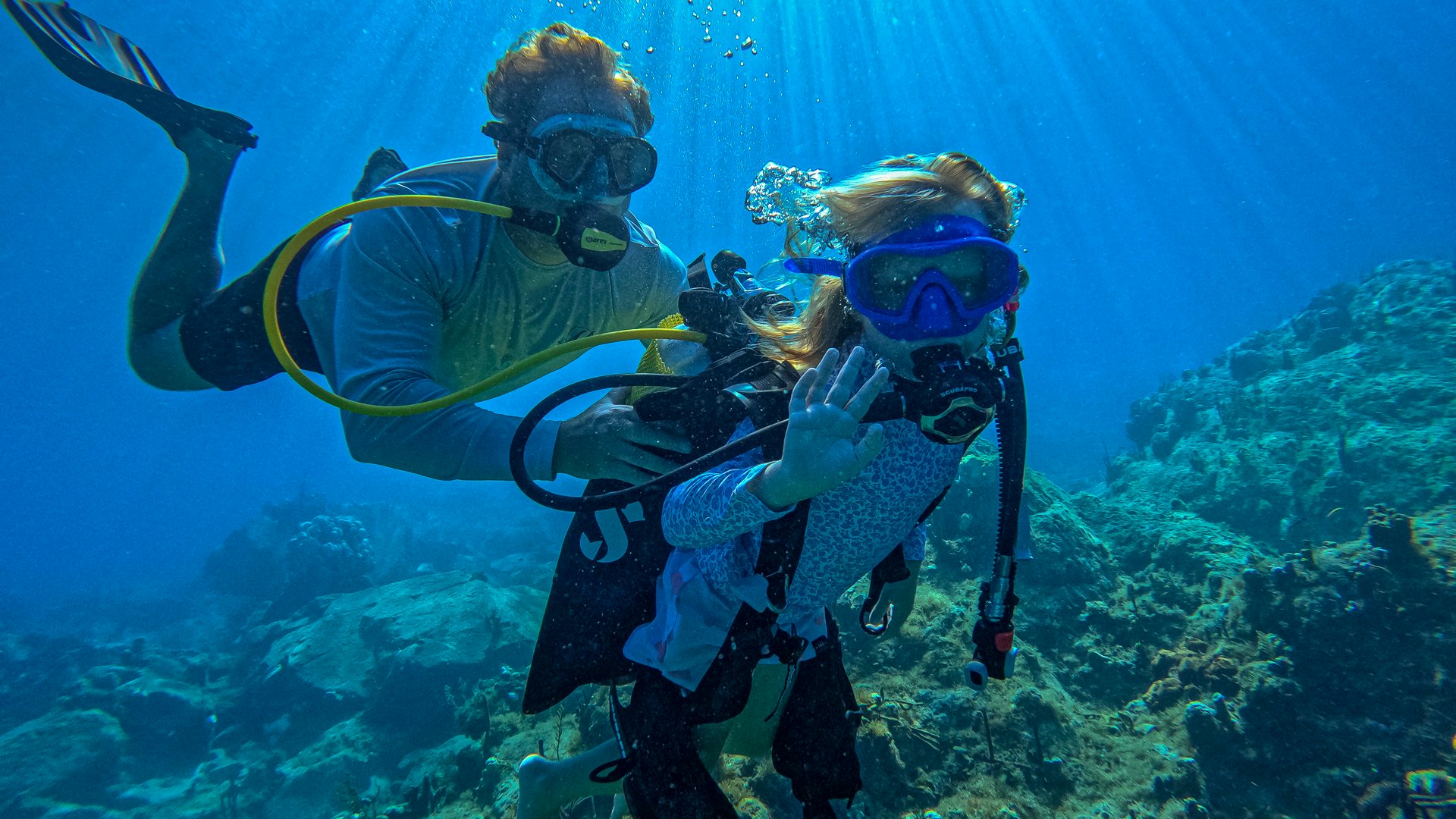 a scuba diver under water aboard MILESTONE Yacht for Charter