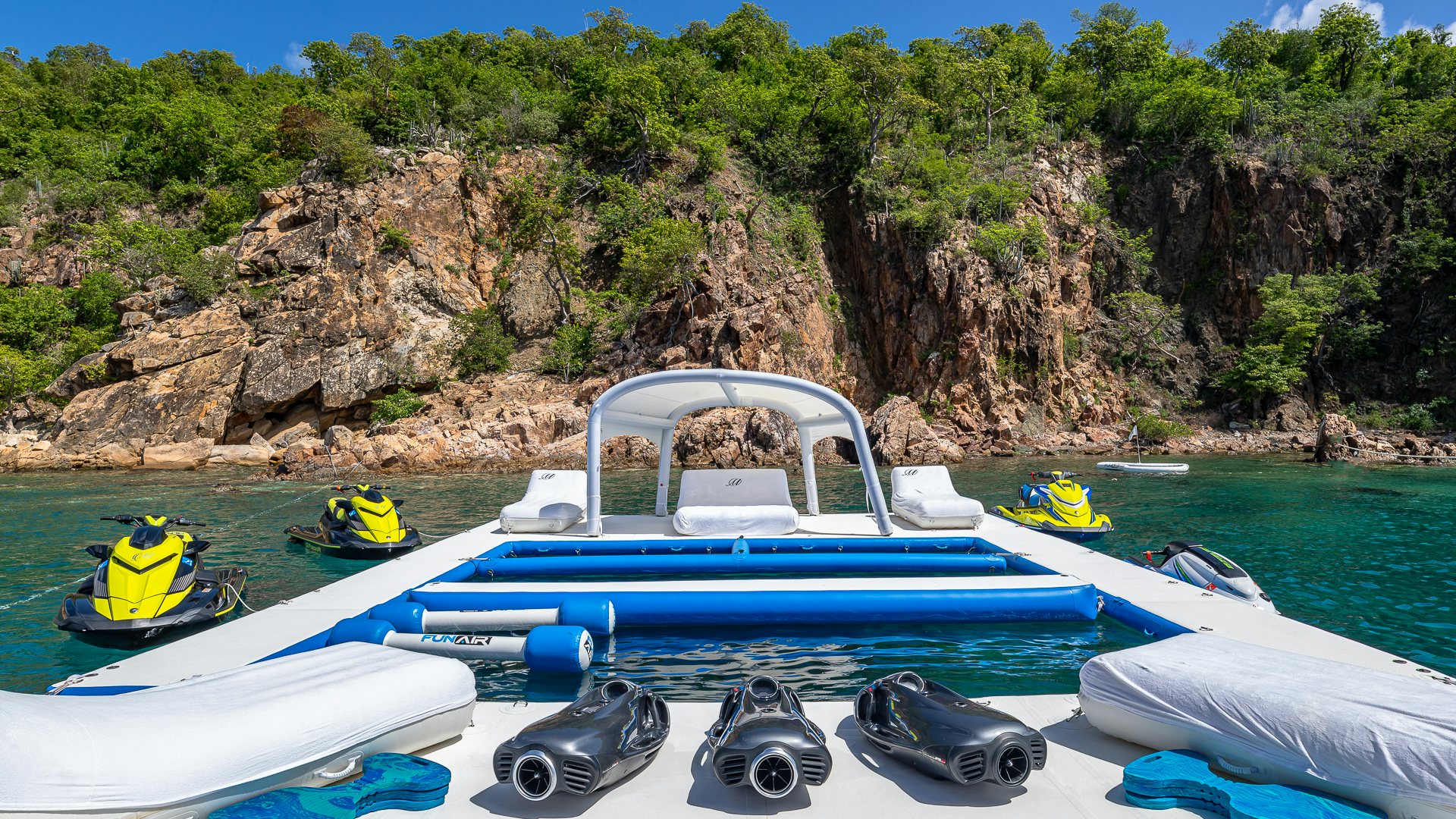 a group of boats on a body of water aboard MILESTONE Yacht for Charter