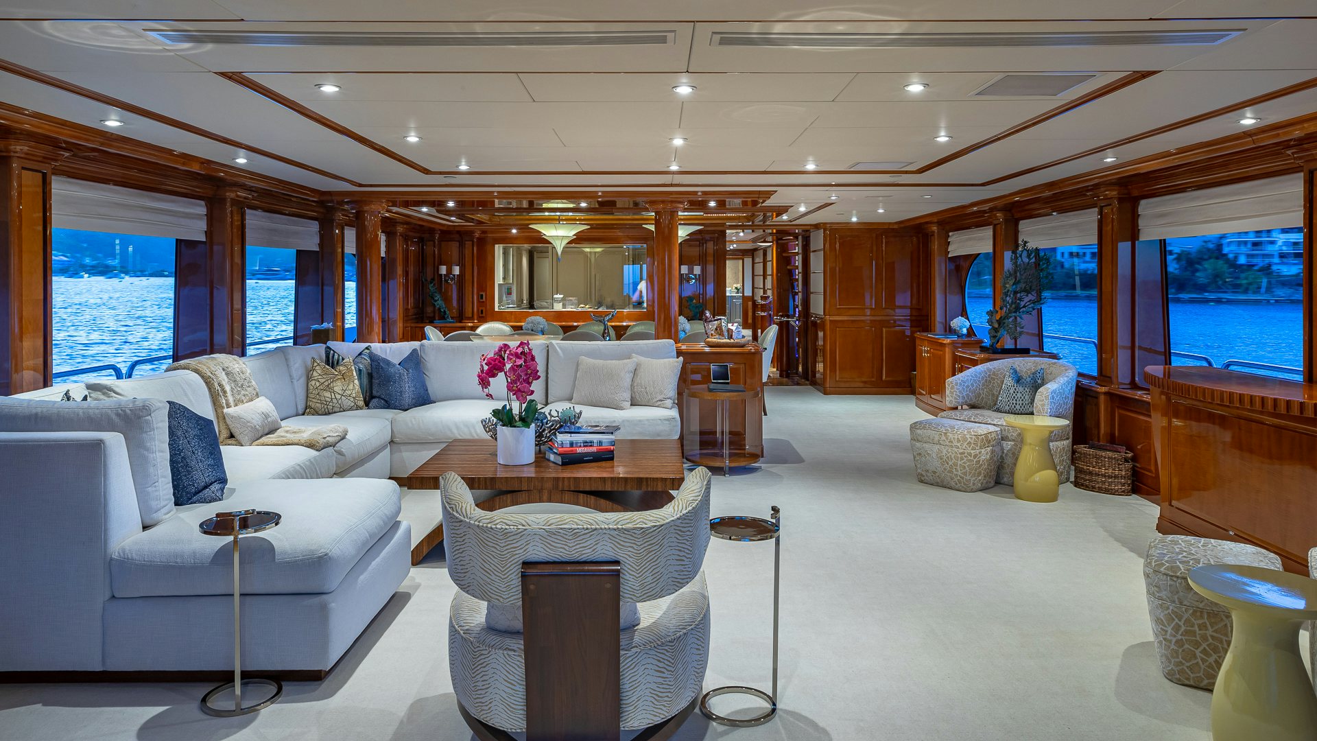 a living room with a couch and a table aboard MILESTONE Yacht for Charter