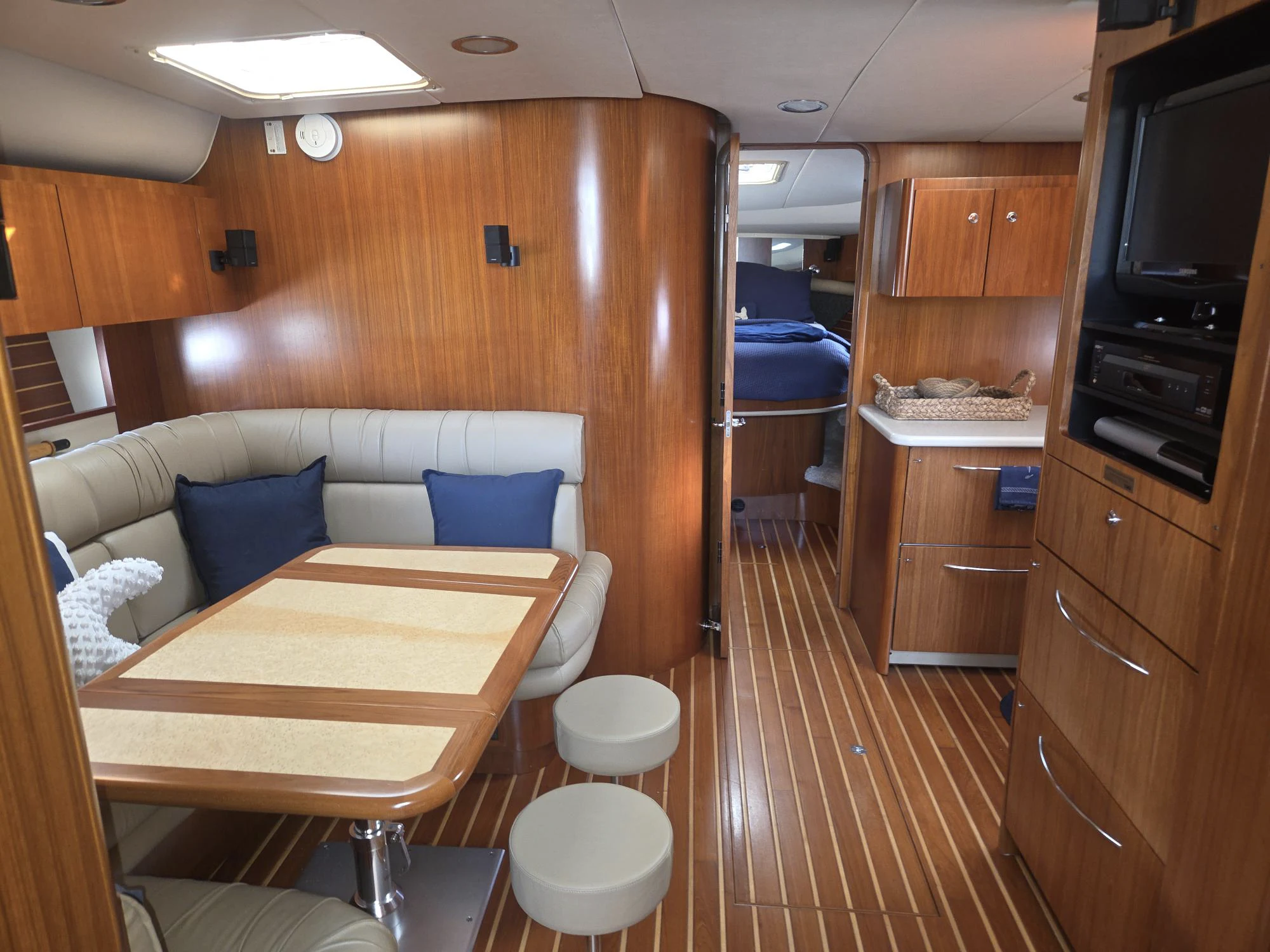a room with a table and chairs aboard GOOD ENERGY TOO Yacht for Sale