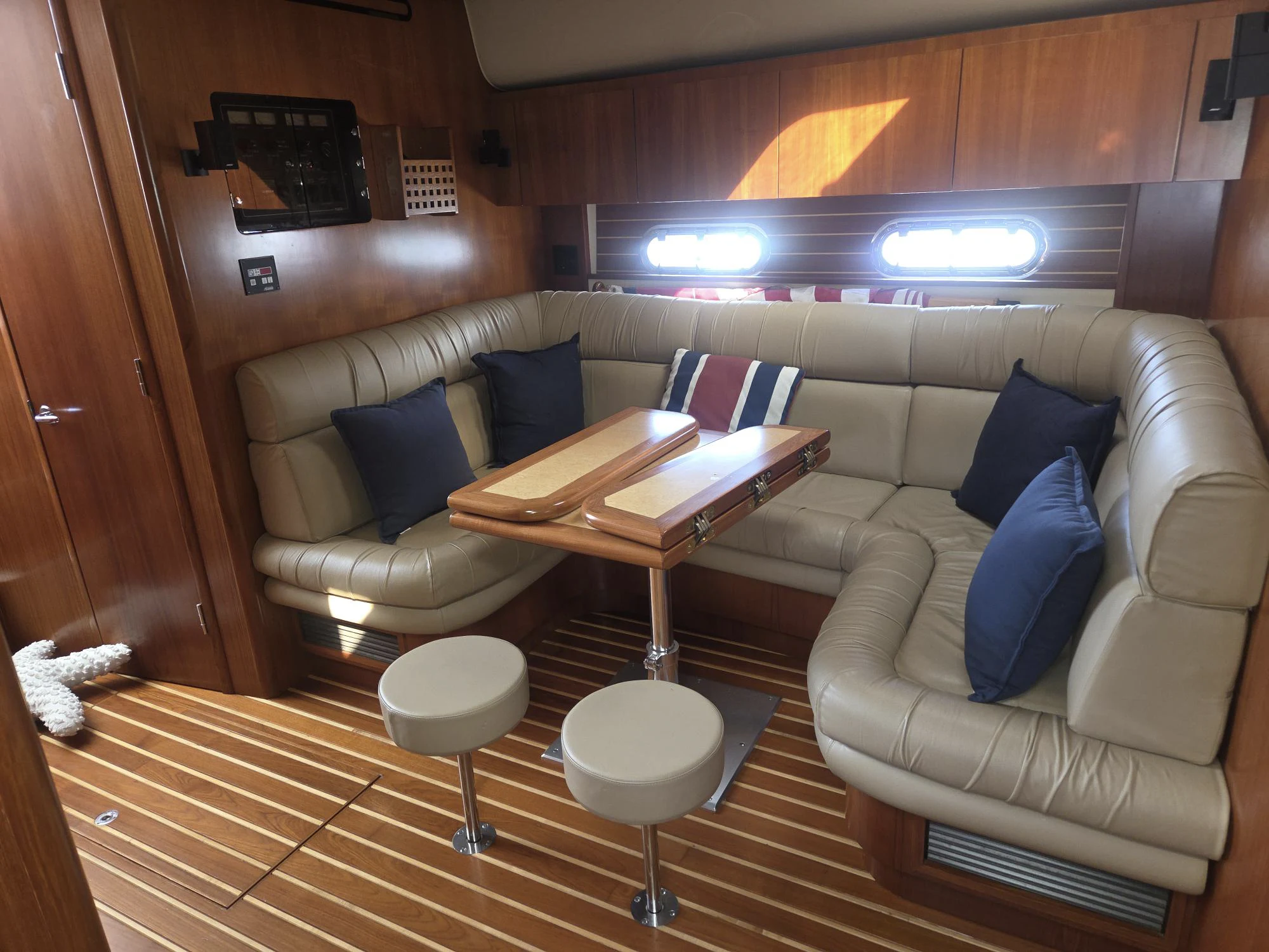 a living room with a couch and a table aboard GOOD ENERGY TOO Yacht for Sale