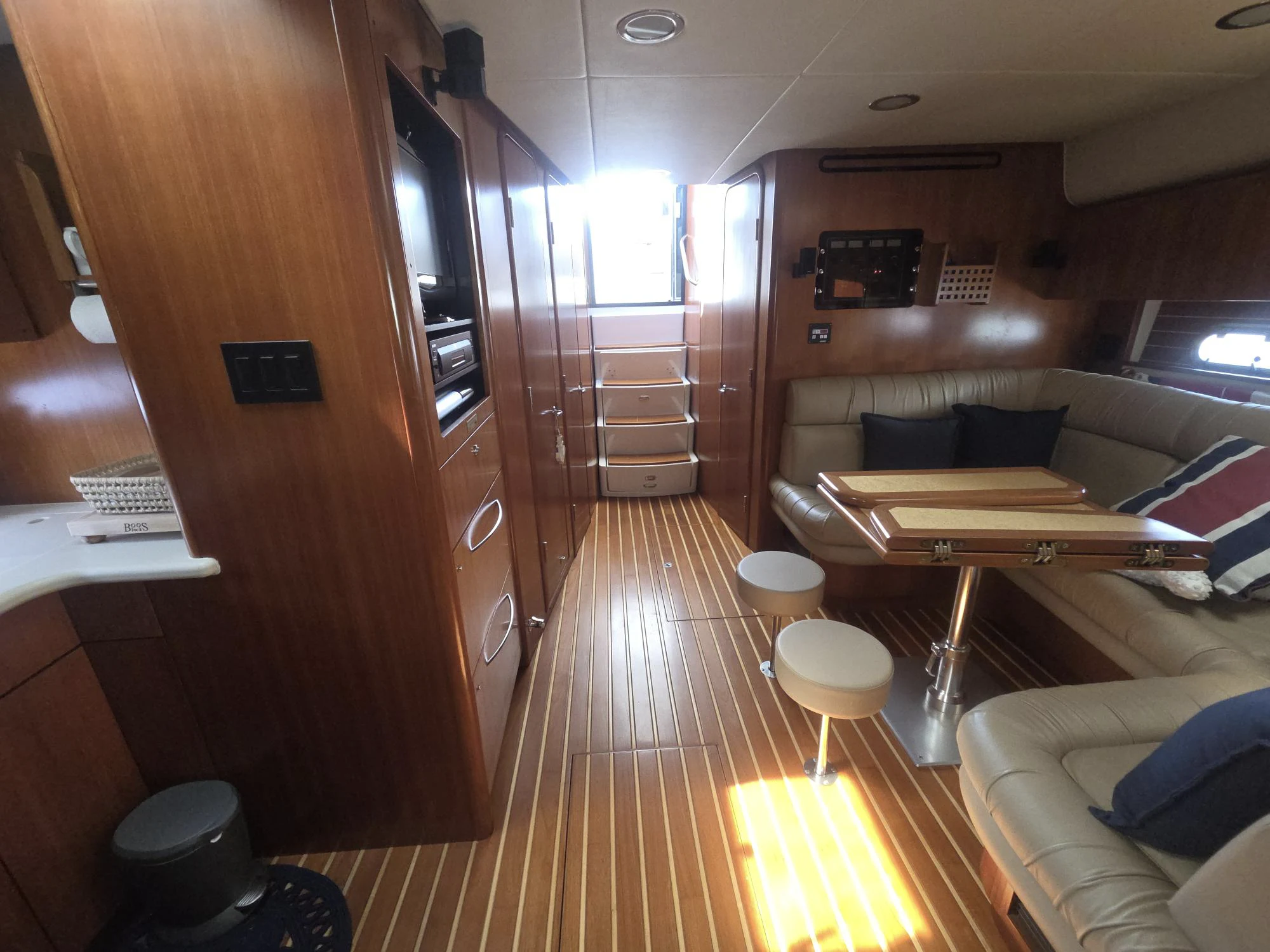 a room with a wood door and a wood floor aboard GOOD ENERGY TOO Yacht for Sale