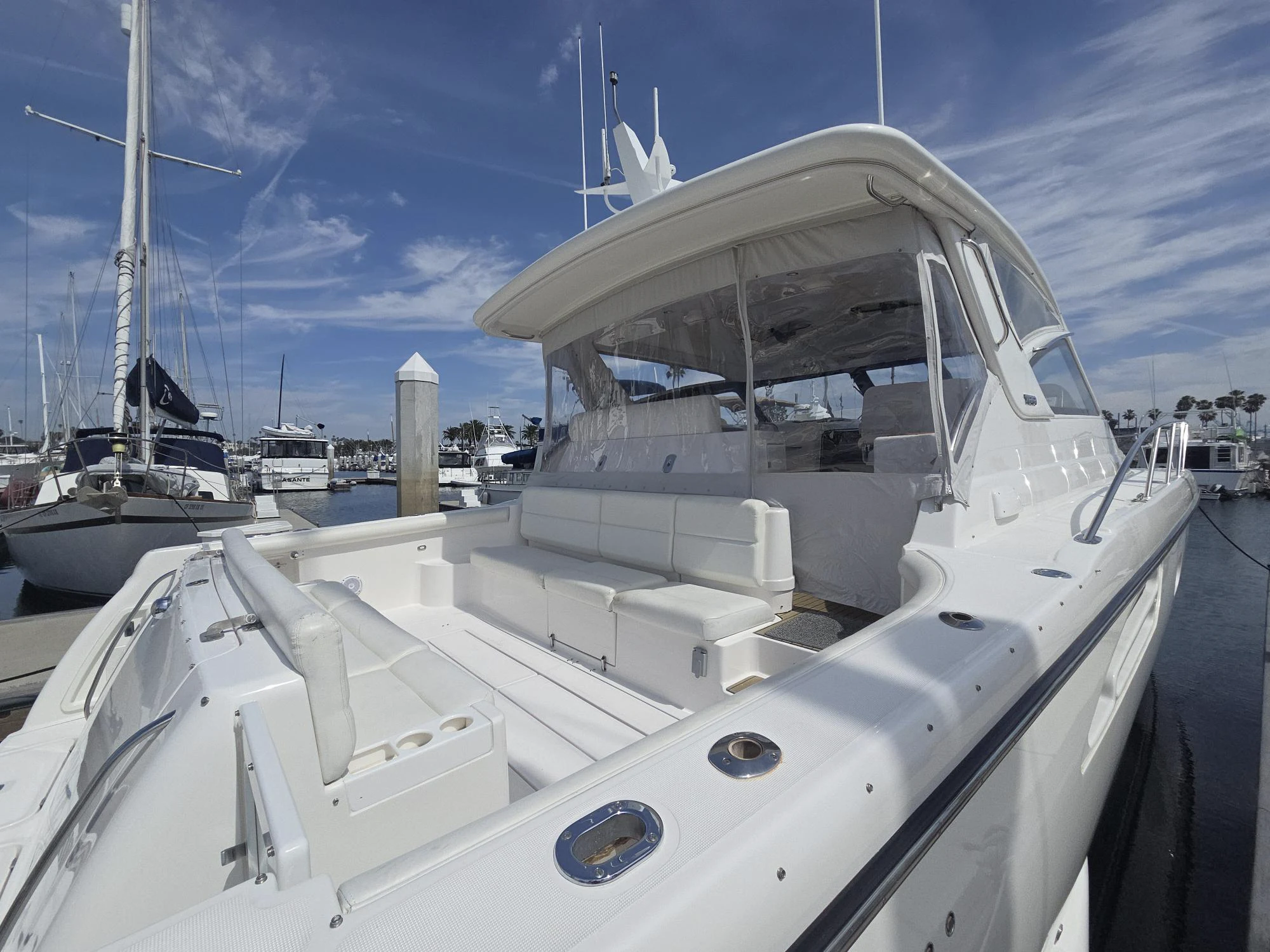 a large white boat in a harbor aboard GOOD ENERGY TOO Yacht for Sale
