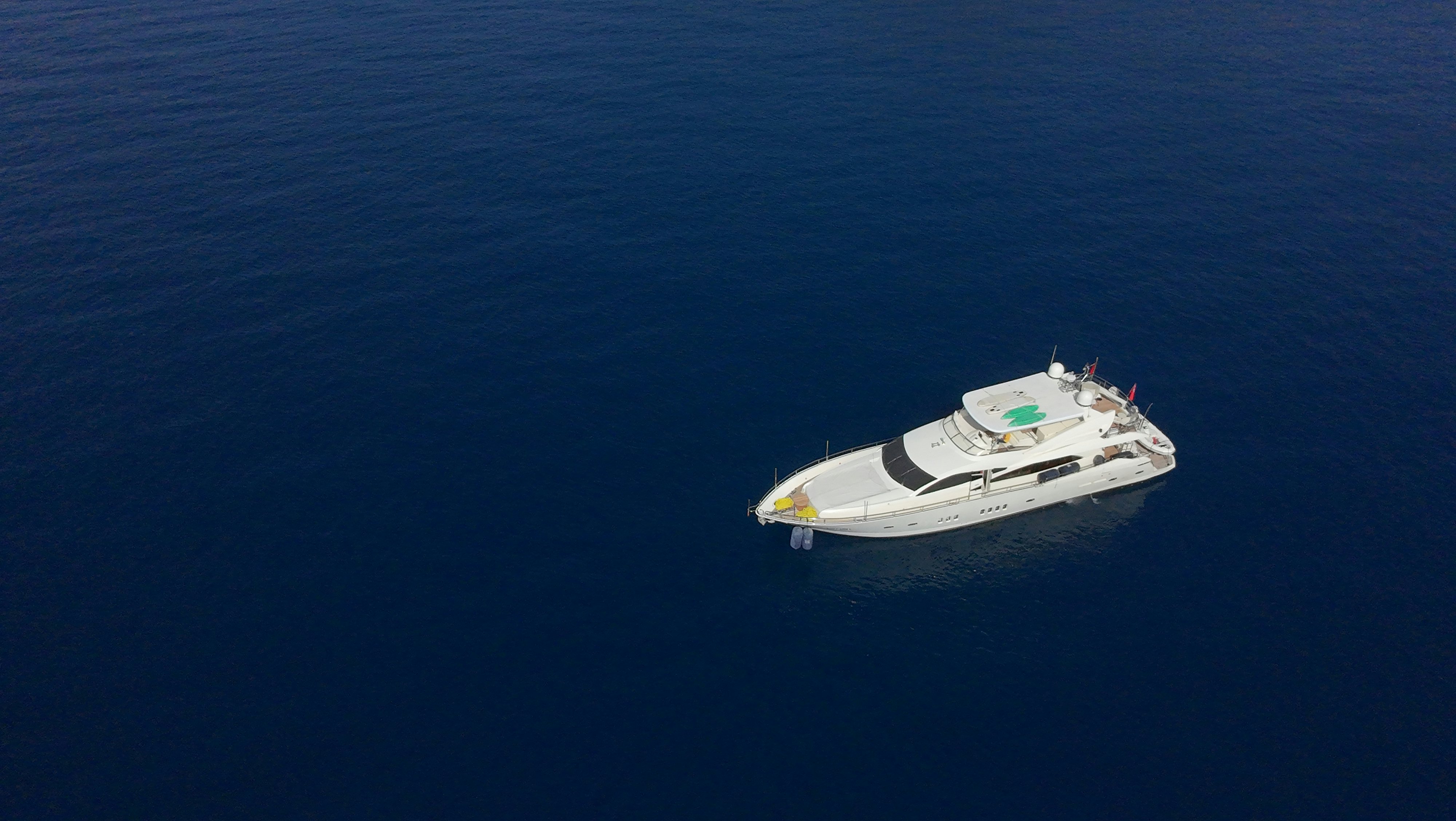 a small boat in the water aboard SWORDFISH 68 Yacht for Sale