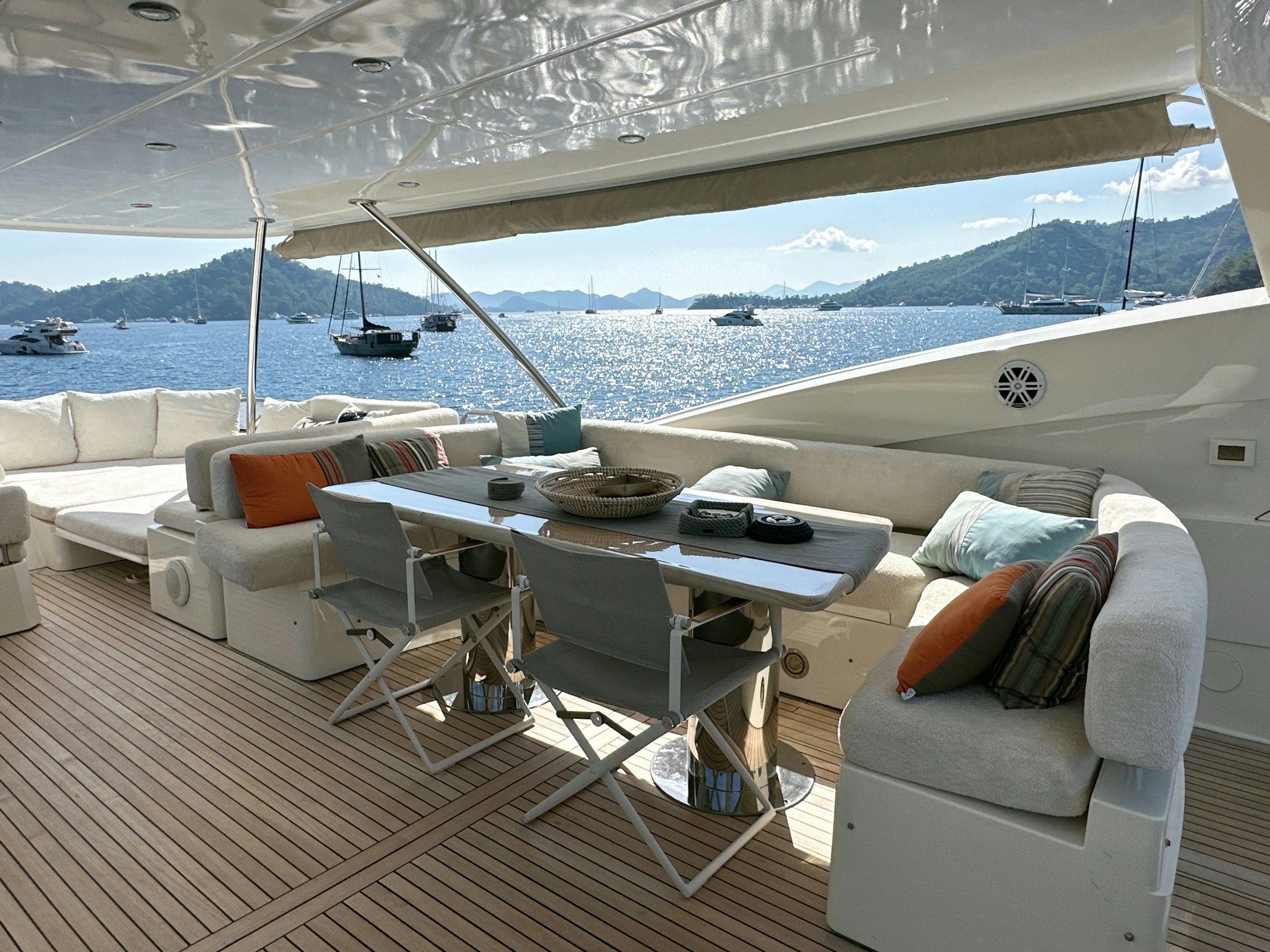 a room with a table and chairs aboard SWORDFISH 68 Yacht for Sale