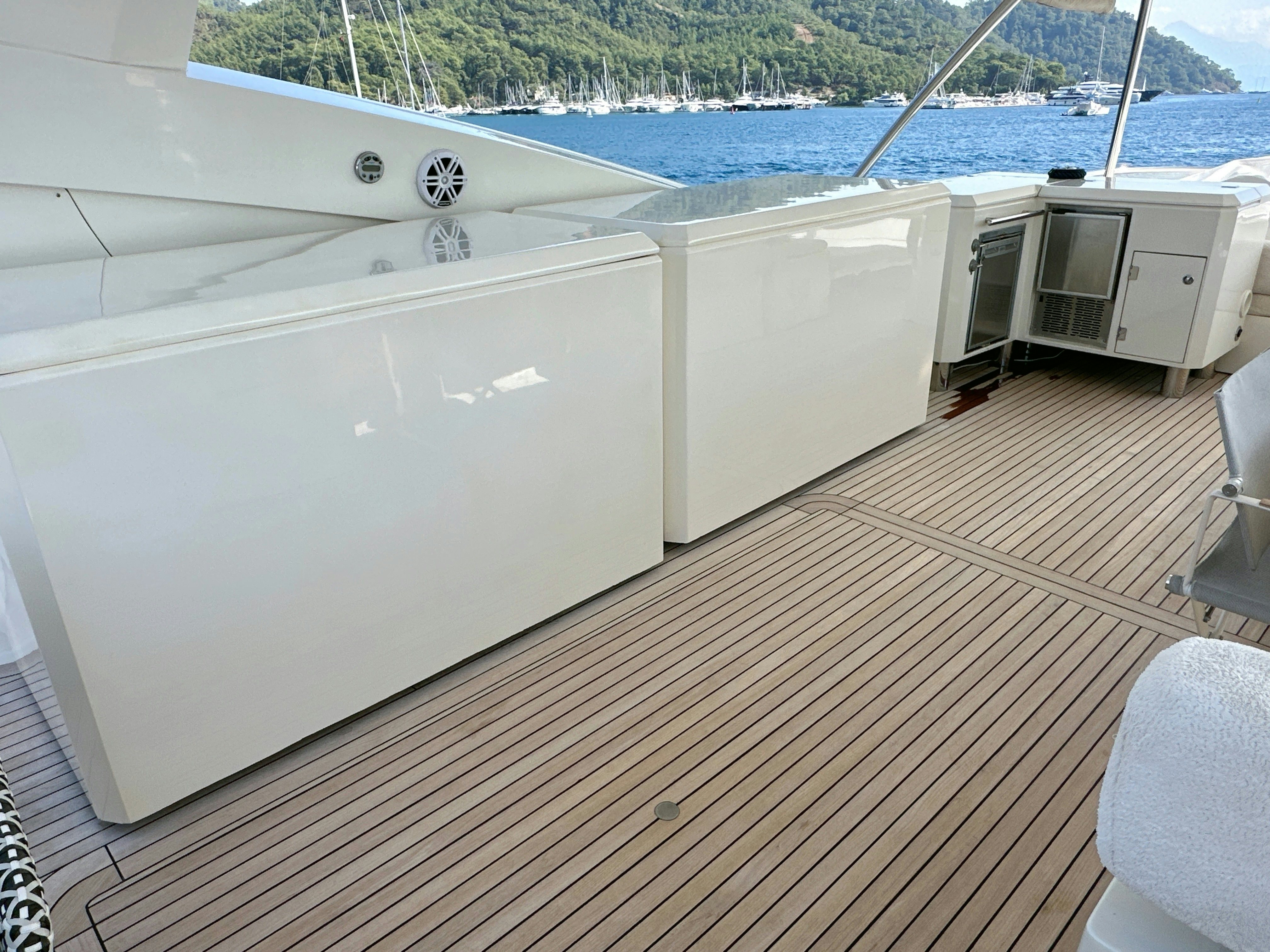 a deck with a large white boat aboard SWORDFISH 68 Yacht for Sale