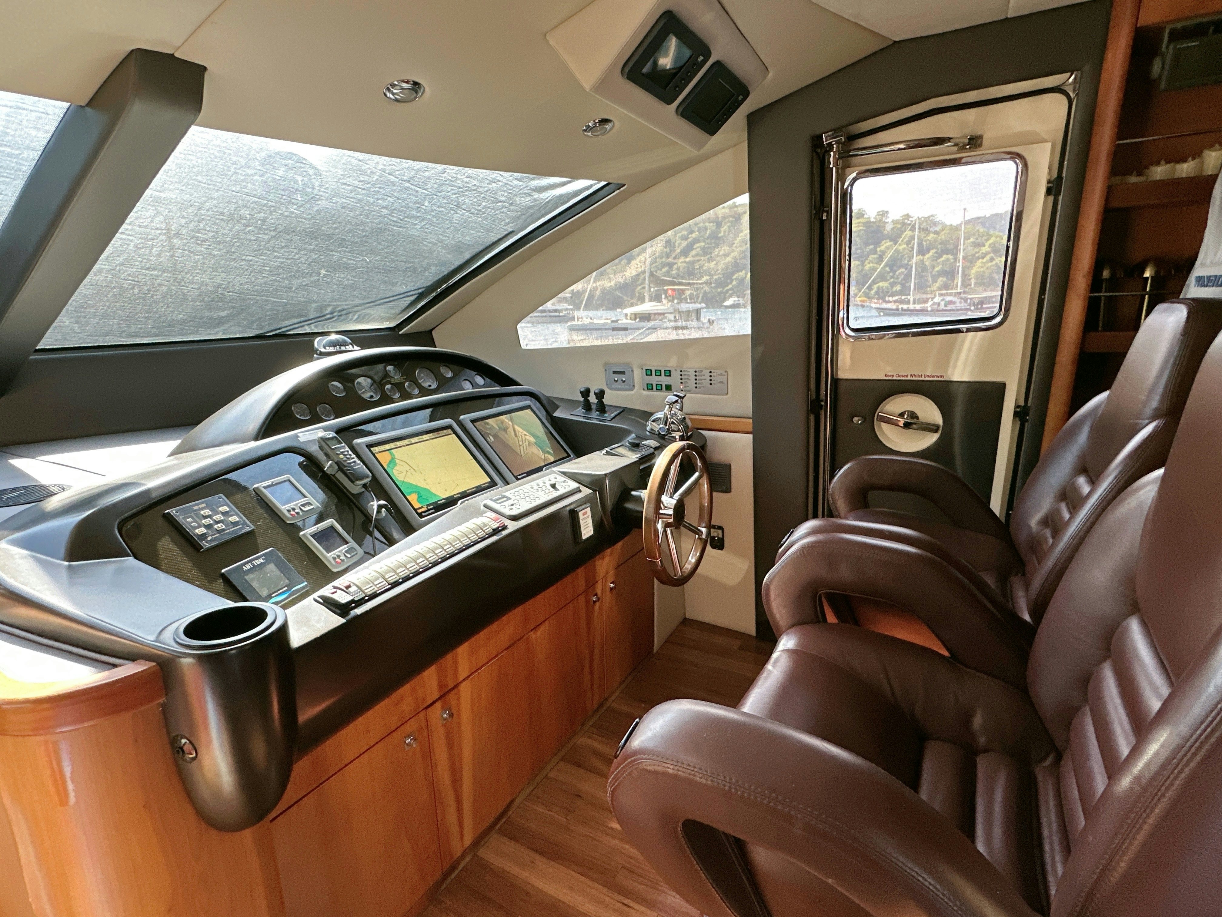 a car with a radio and a seat aboard SWORDFISH 68 Yacht for Sale