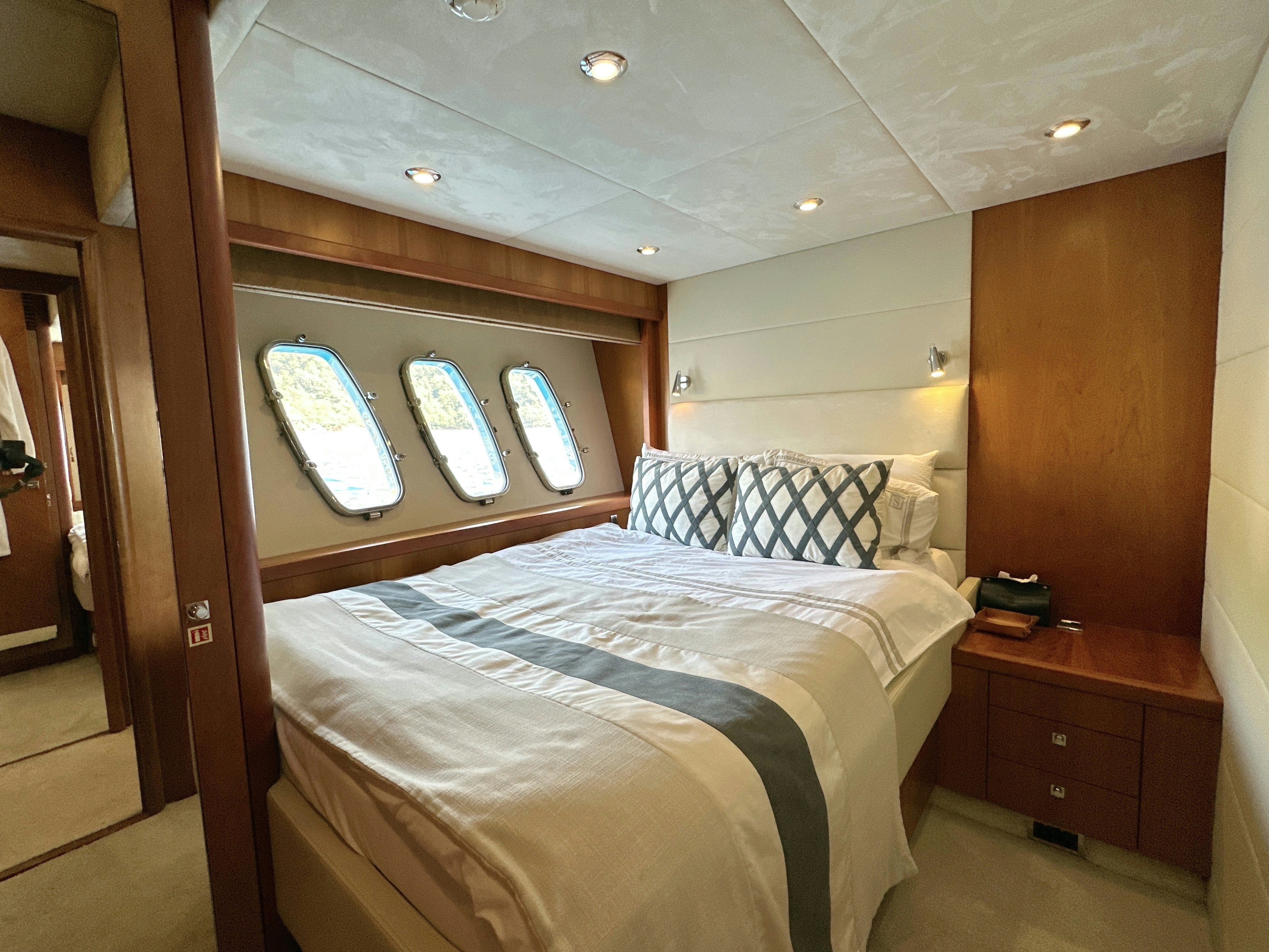 a bed in a room aboard SWORDFISH 68 Yacht for Sale