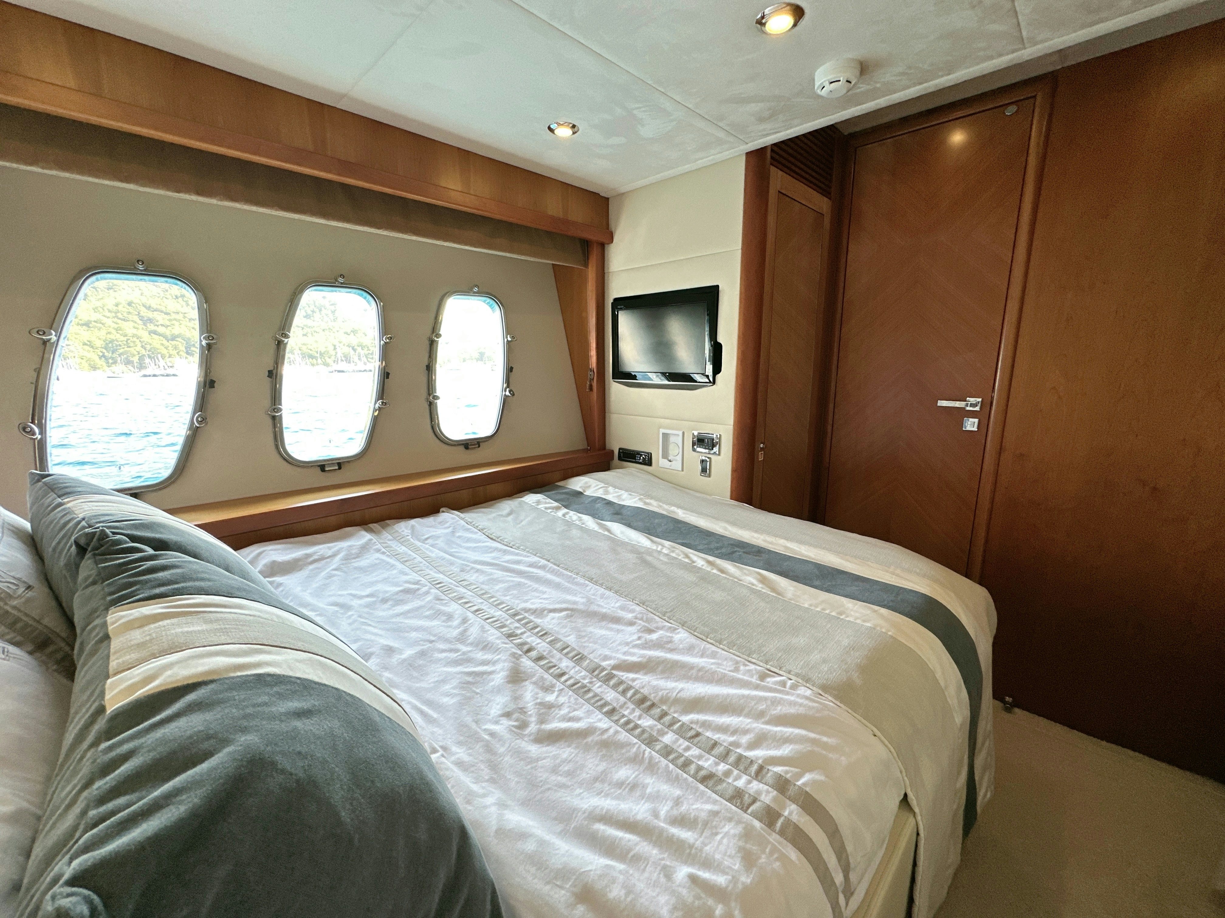 a bed in a cabin aboard SWORDFISH 68 Yacht for Sale