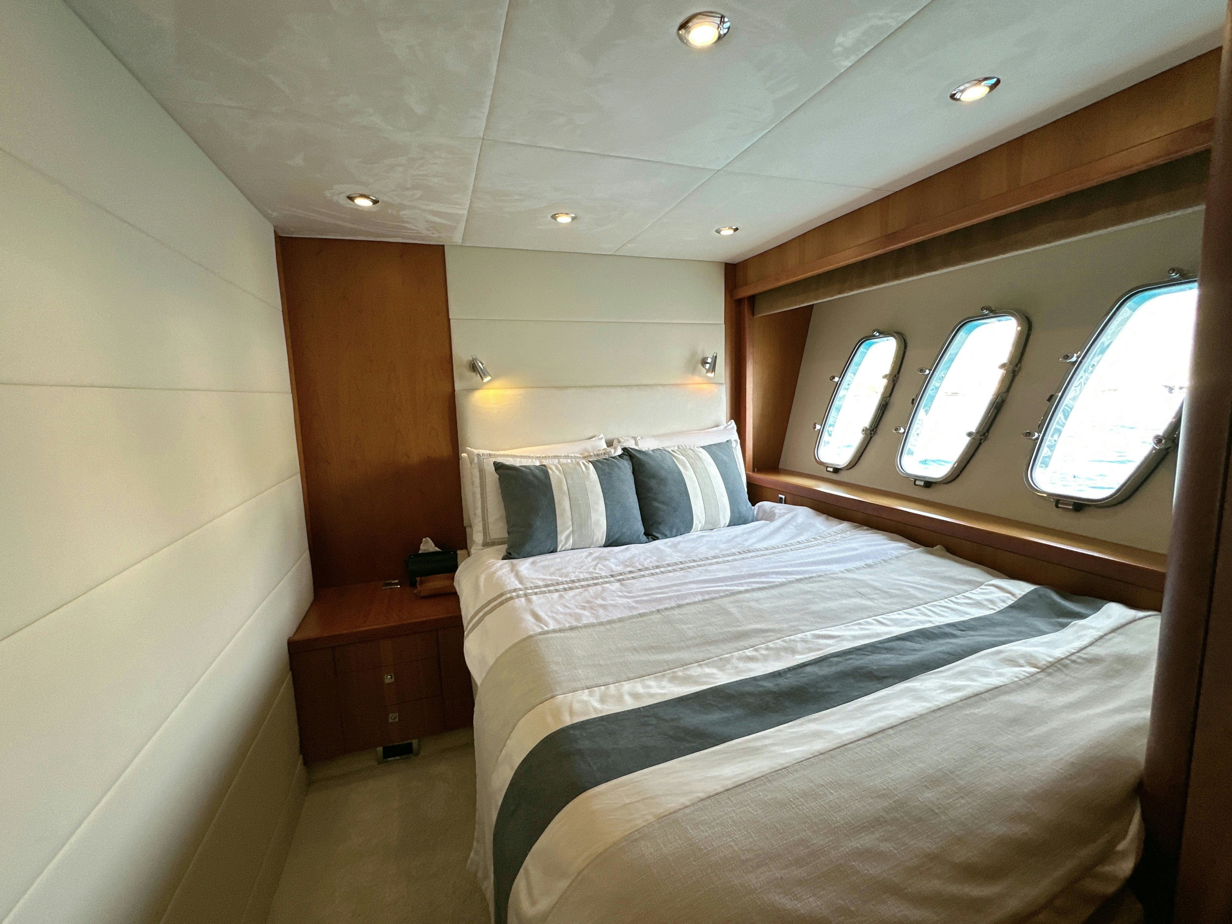 a bed in a room aboard SWORDFISH 68 Yacht for Sale