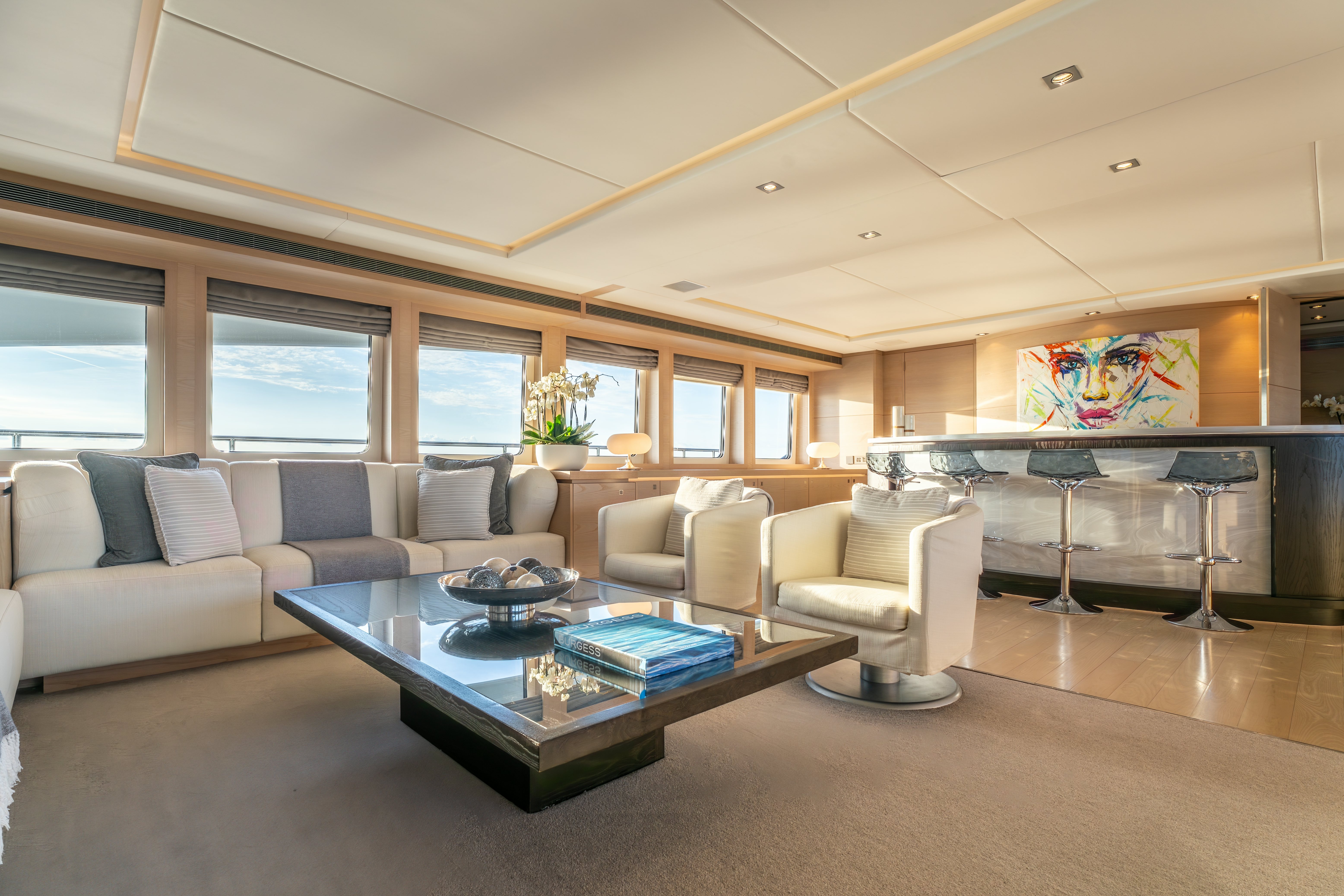 a living room with a large window aboard G3 Yacht for Sale