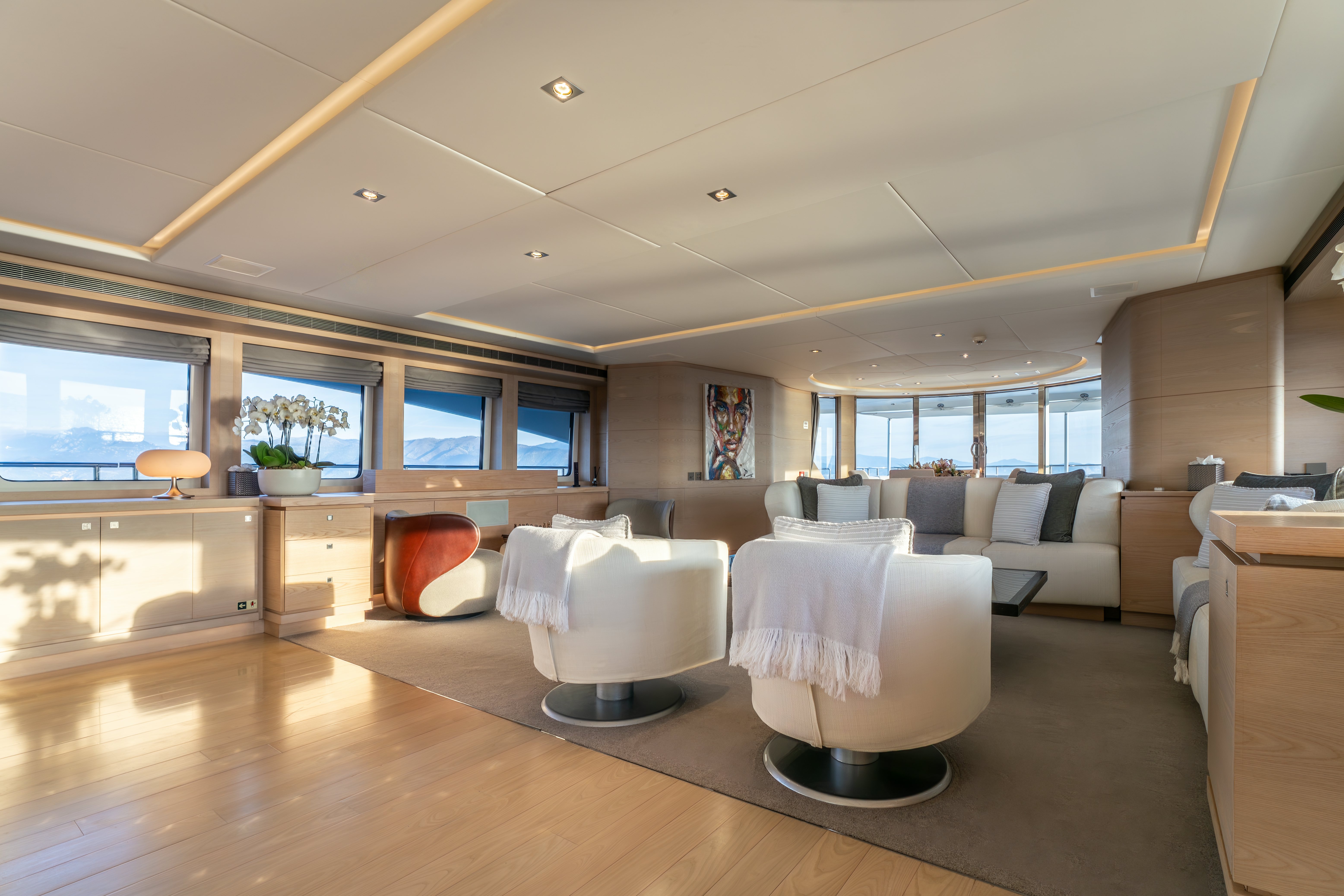 a living room with a large window aboard G3 Yacht for Sale
