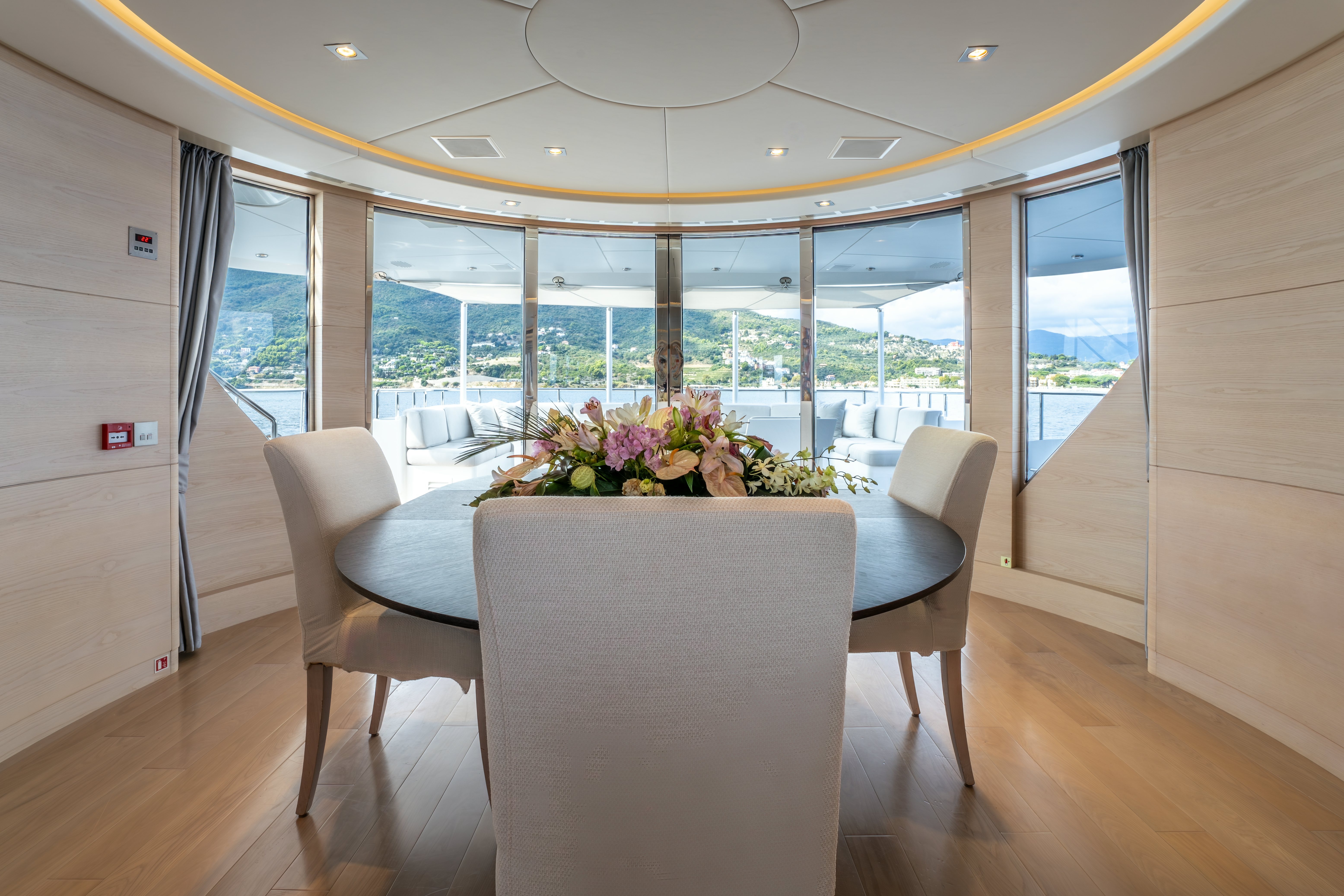 a room with a table and chairs aboard G3 Yacht for Sale