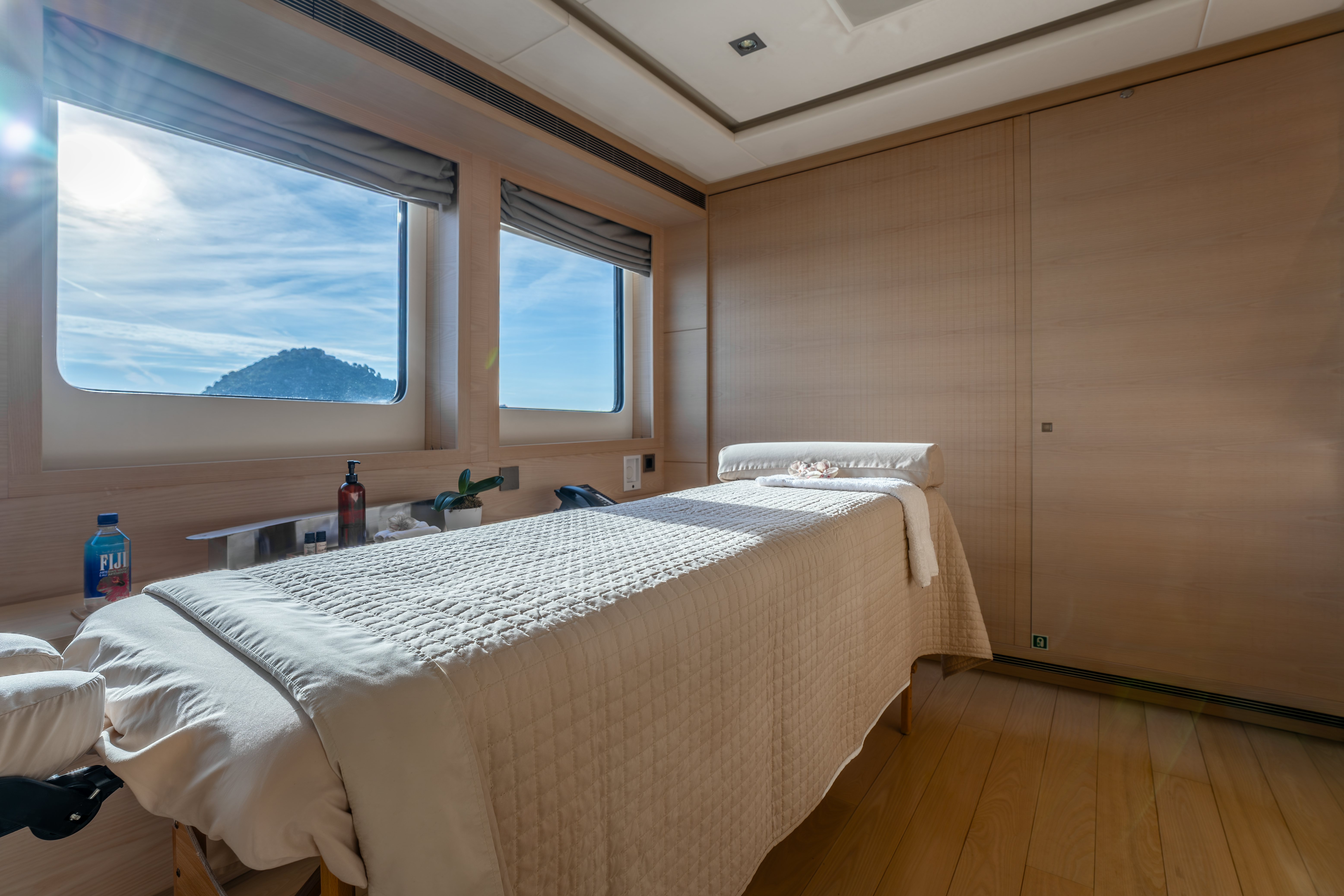 a room with a bed and a window aboard G3 Yacht for Sale