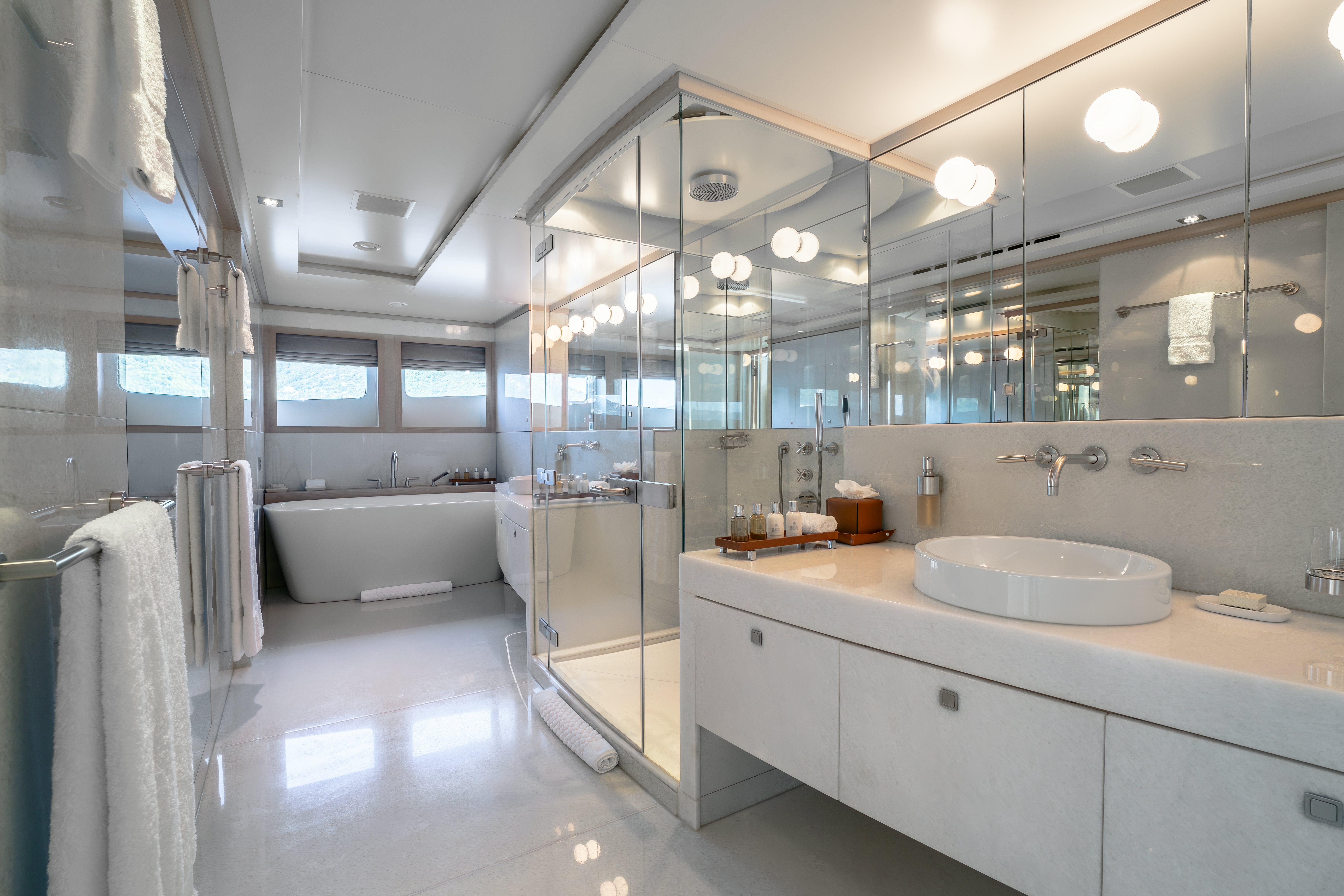 a bathroom with a large mirror aboard G3 Yacht for Sale