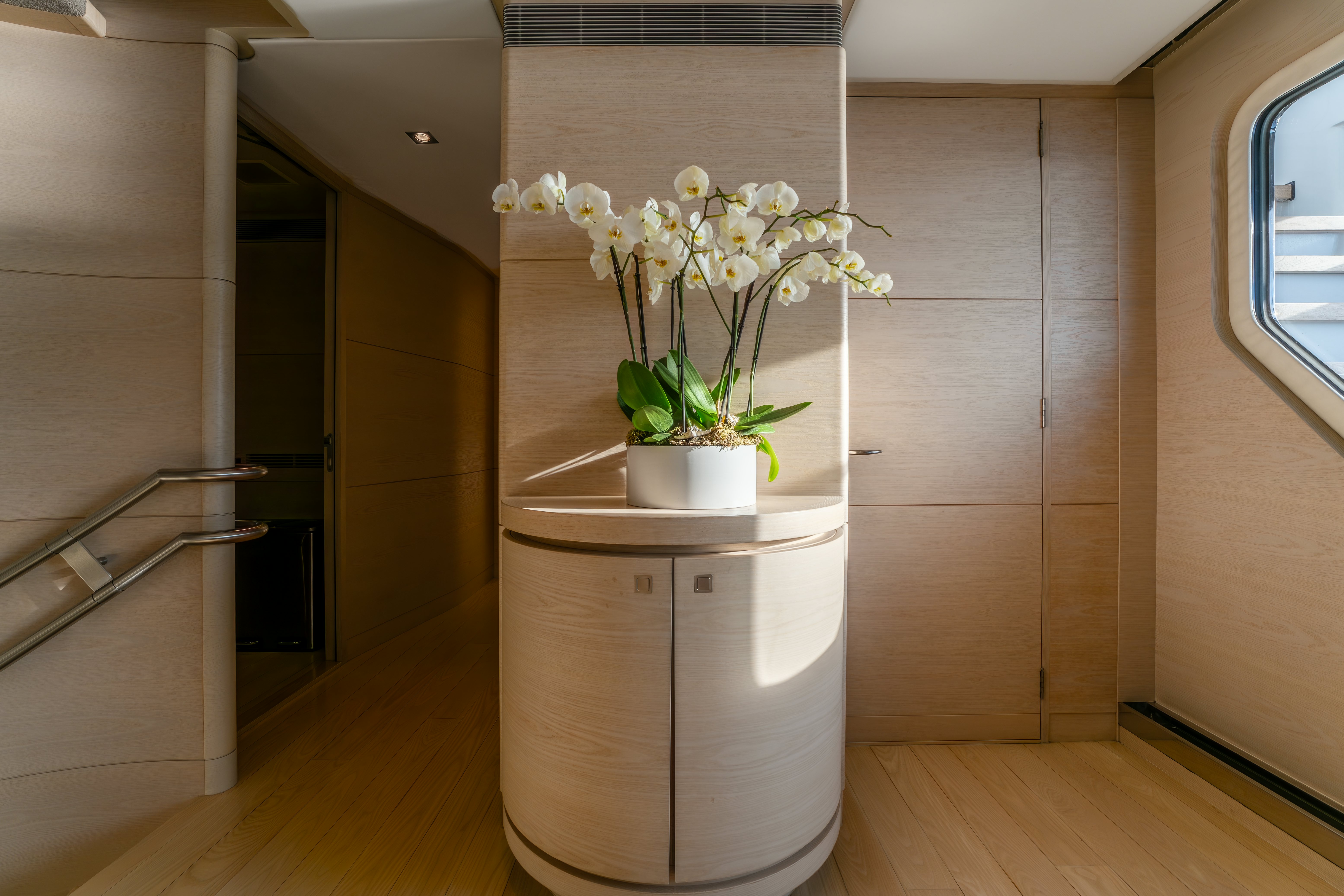 a vase with white flowers in it aboard G3 Yacht for Sale